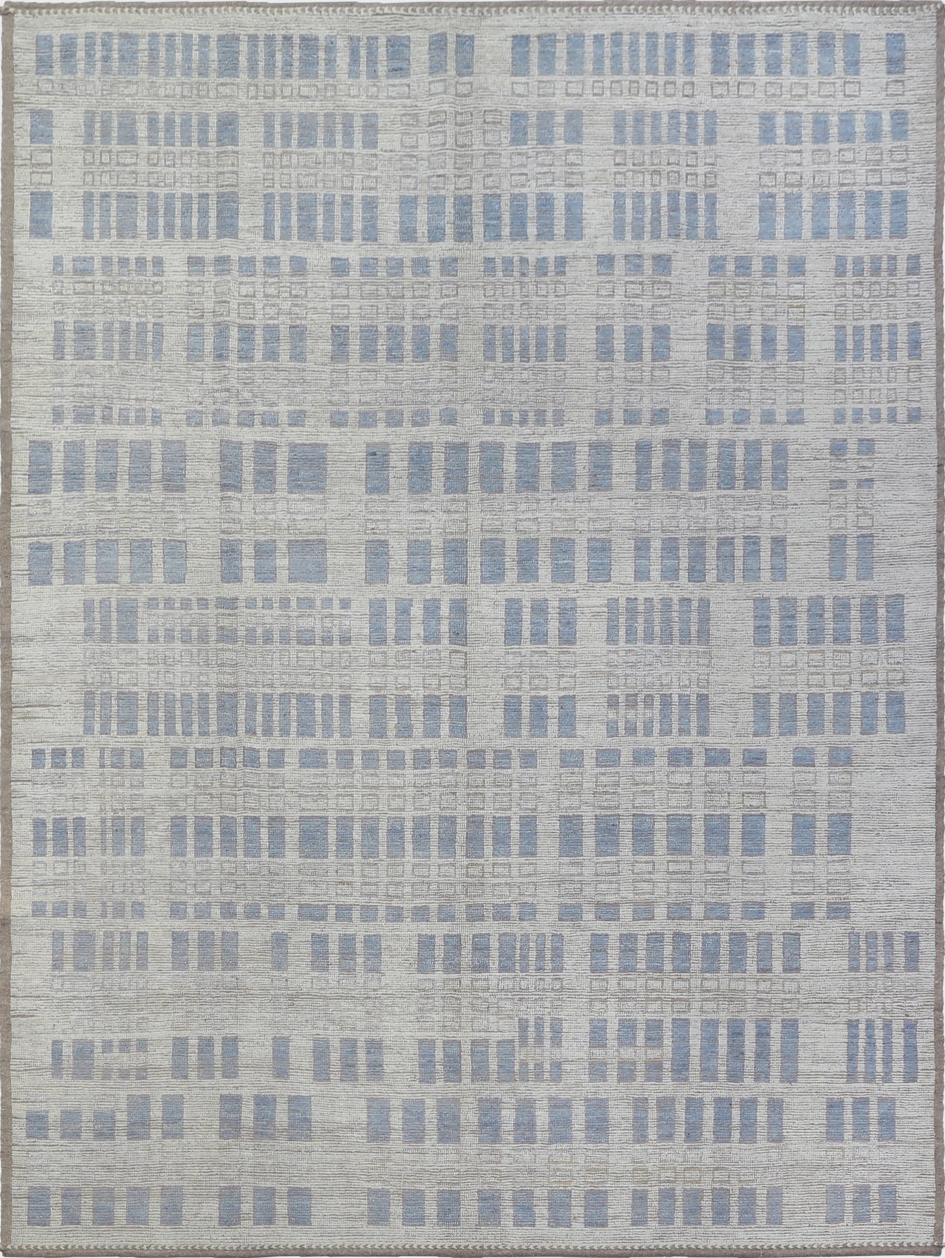 A hand-knotted Karakul 10x14 modern wool rug in a light blue and cream colour combination.