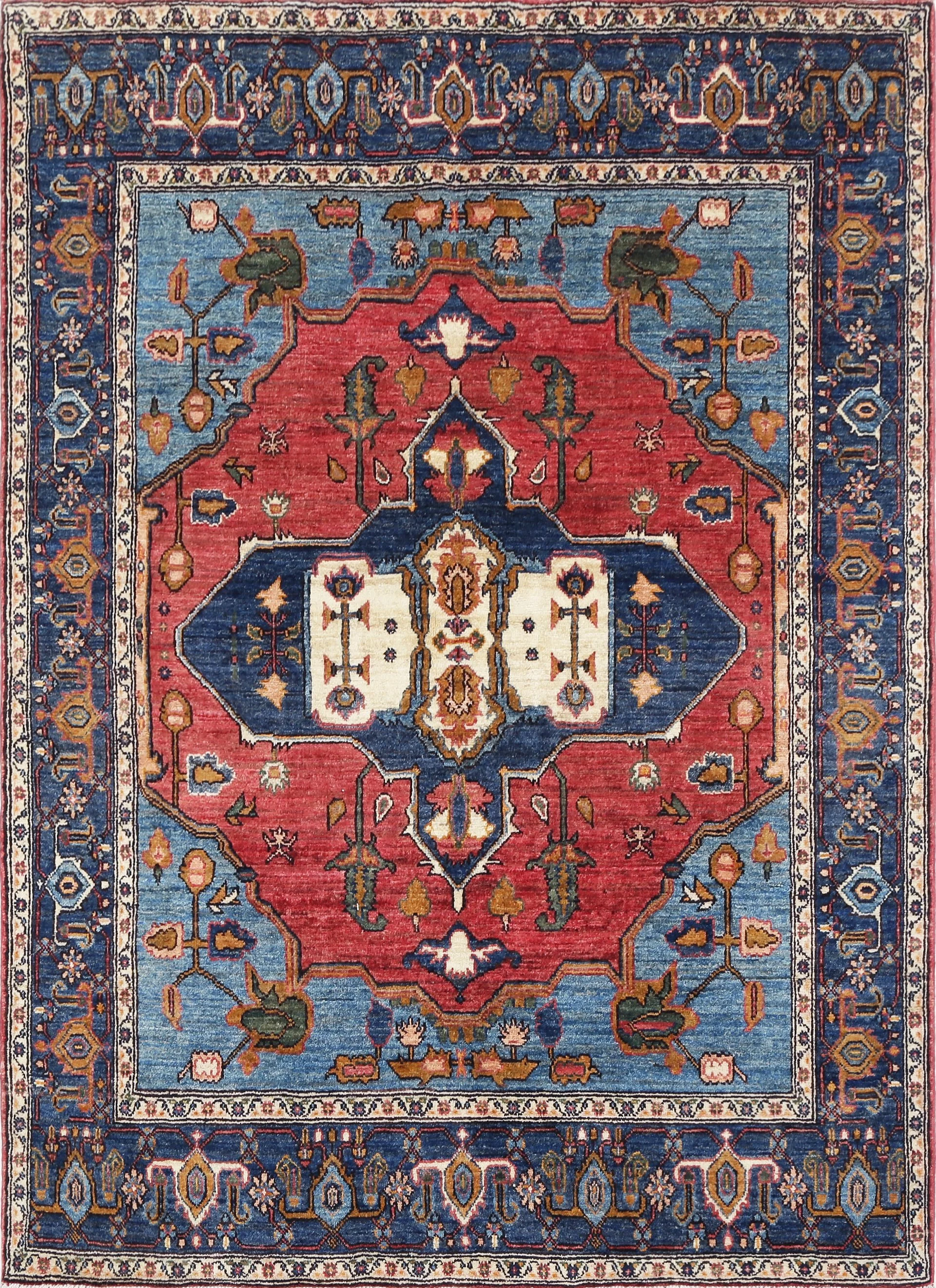 A hand-knotted wool rug featuring a Serapi design.