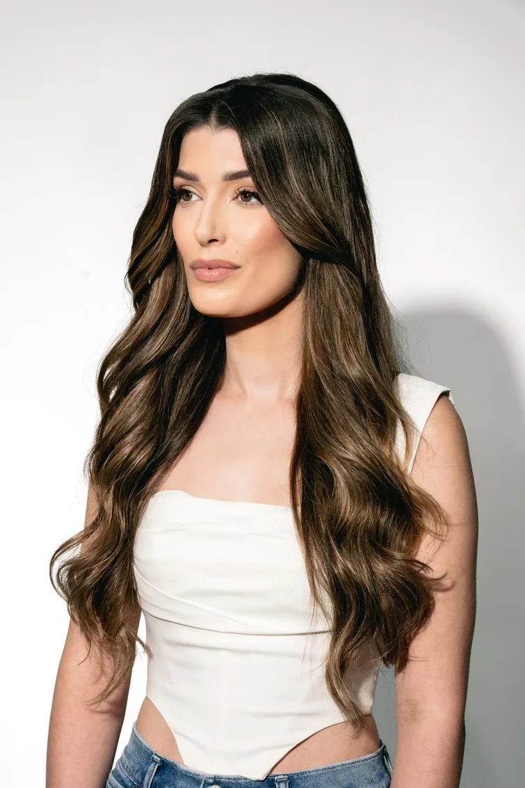 Bride with soft curls and glowing makeup