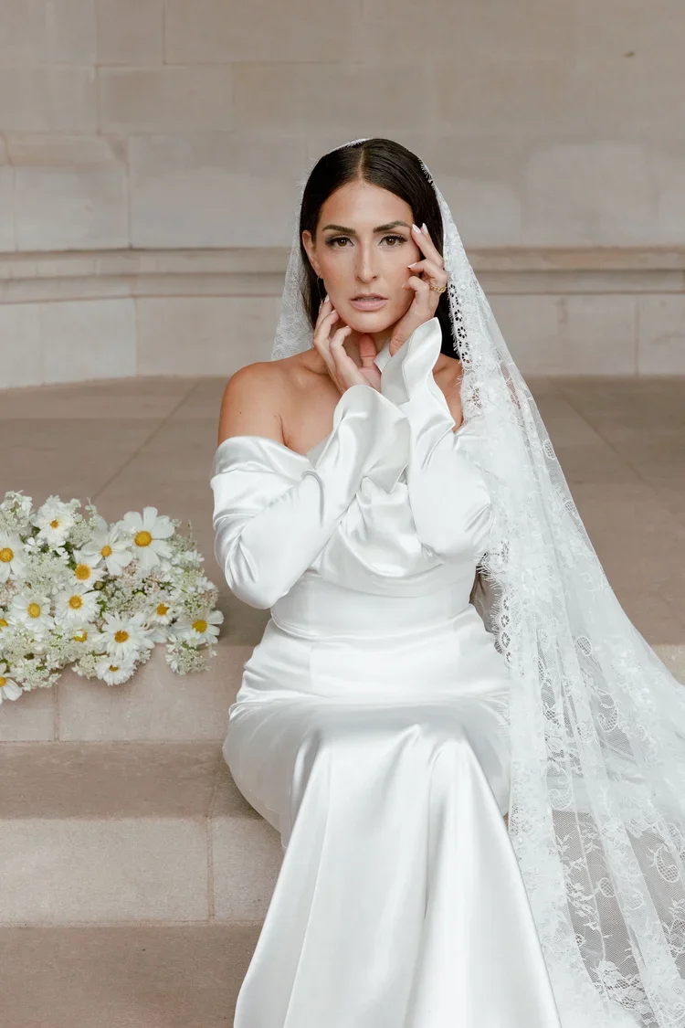 Bride wearing veil with polished bridal makeup.webp