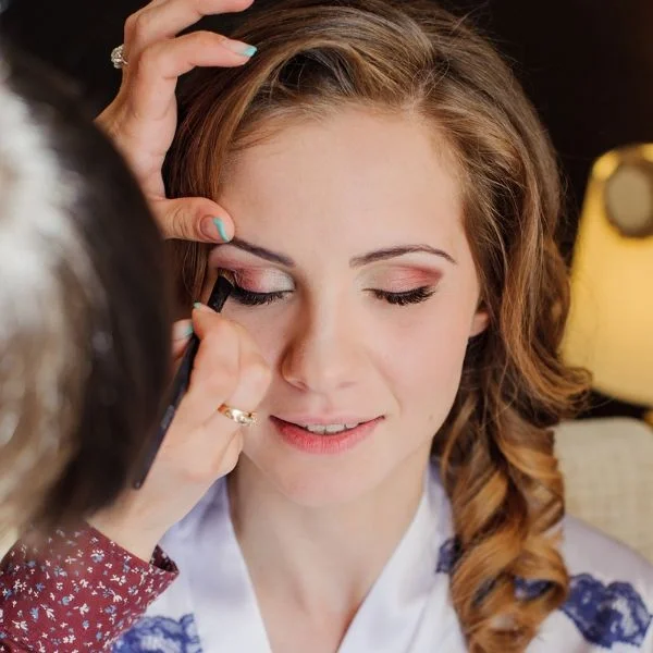 bride with make up artist in Washing, DC