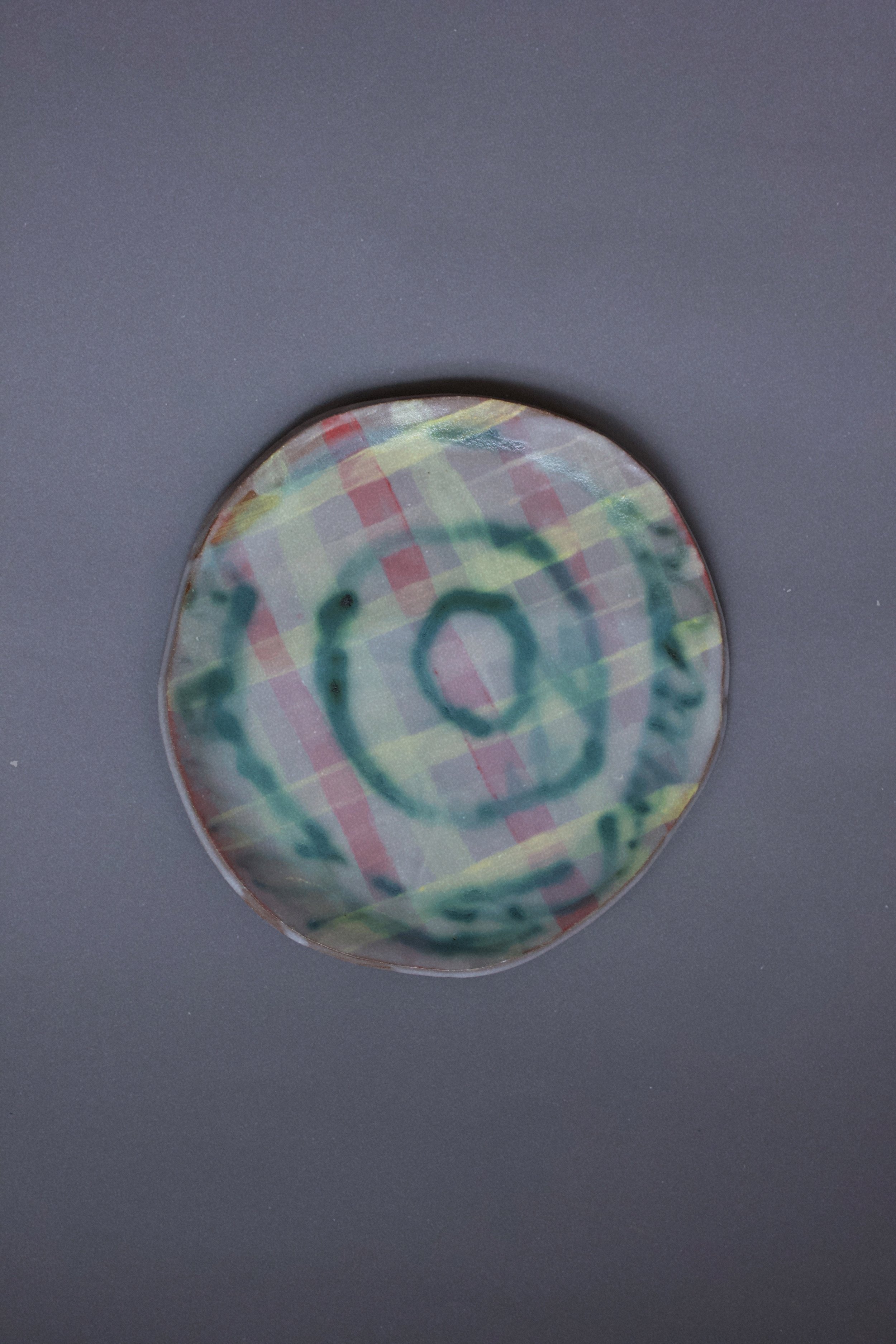 plate with a green swirl