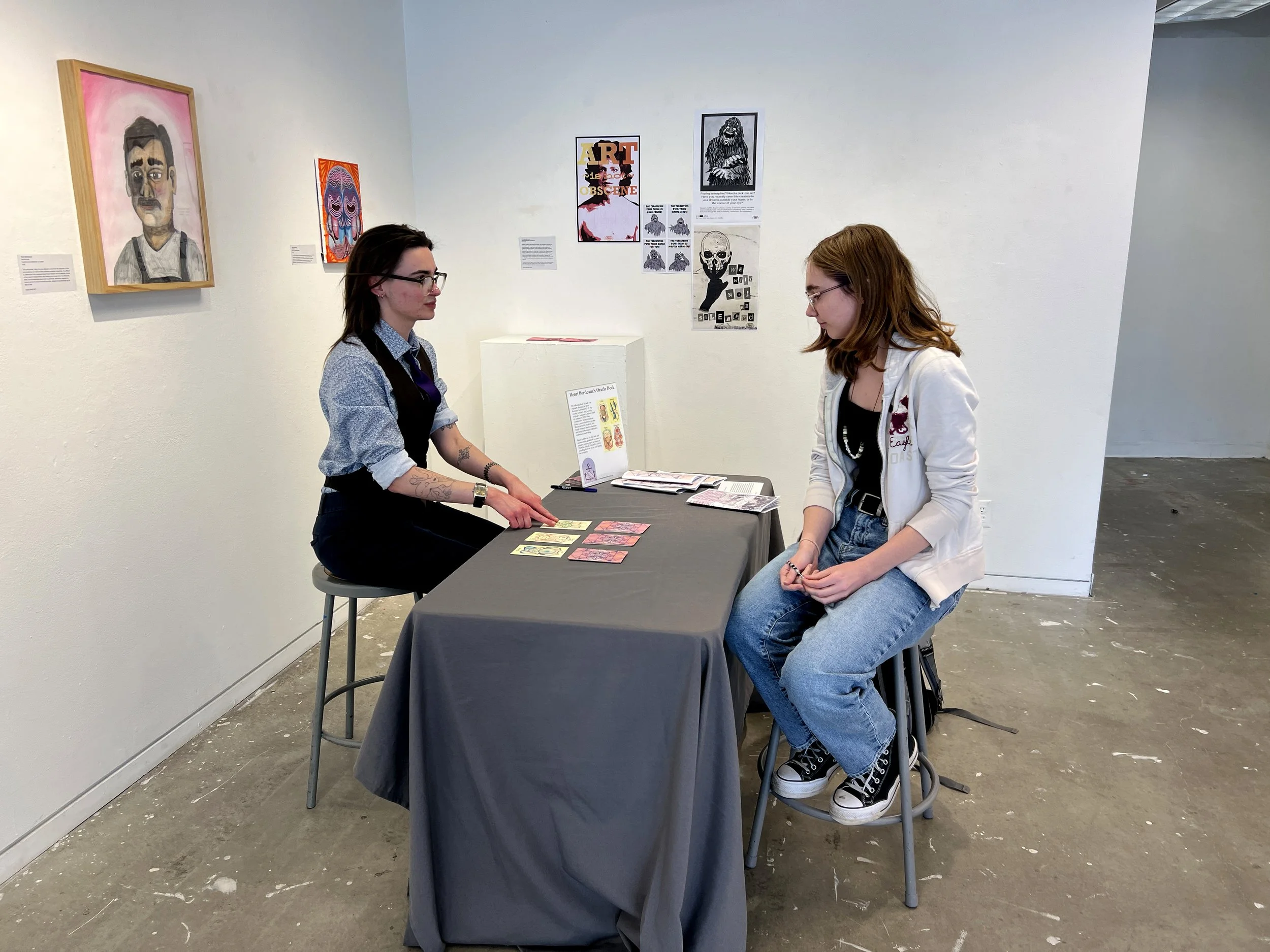 Collaborative Archival Assistants River Kirby and Emma Lane engage in a reading using Henri Bordeaux's oracle deck. 