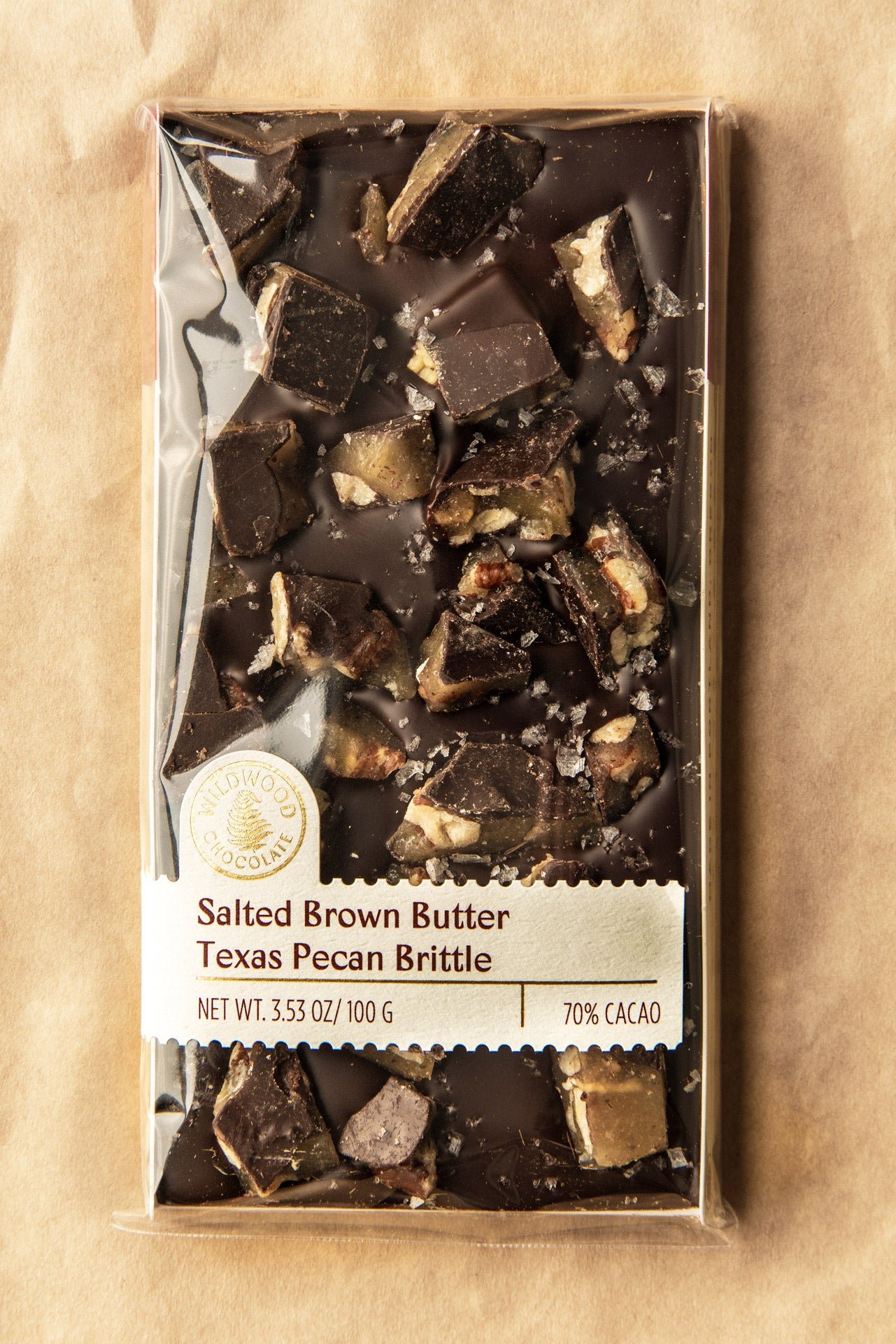 SaltedBrownButterTexasPecanBrittlePackagedonBrownPaper-2.jpeg