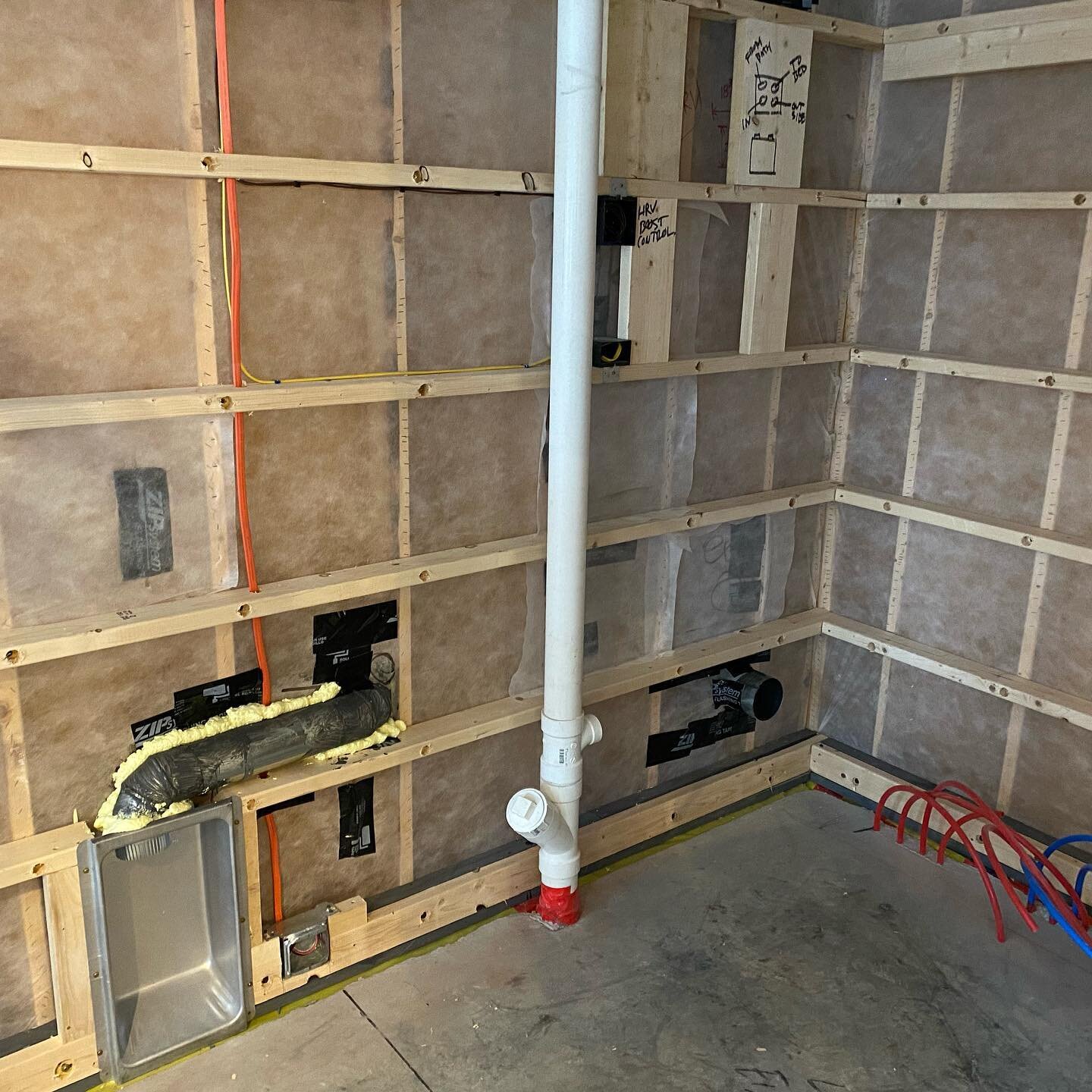 The guts! Prior to Sheetrock a lot of blocking was added to aid in future millwork and cabinets.  In addition, these photos include dimensions recorded on the blocking for easy finding later on.  Also, dense pack insulation in the 2x6 exterior wall a