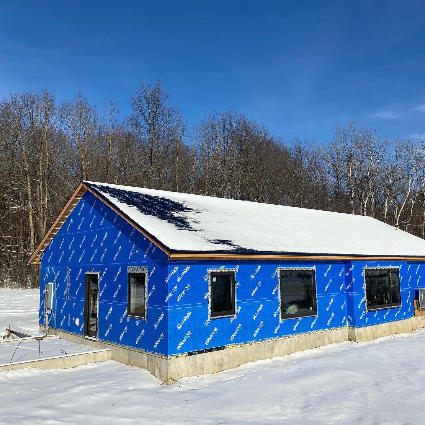 Exterior- peel and stick membrane VP100 blueskin over 5/8 advantech plywood.  Coming up; cedar breather (home slicker classic), and cedar shakes.  #belgianwoodworks #turnkeybuilders.