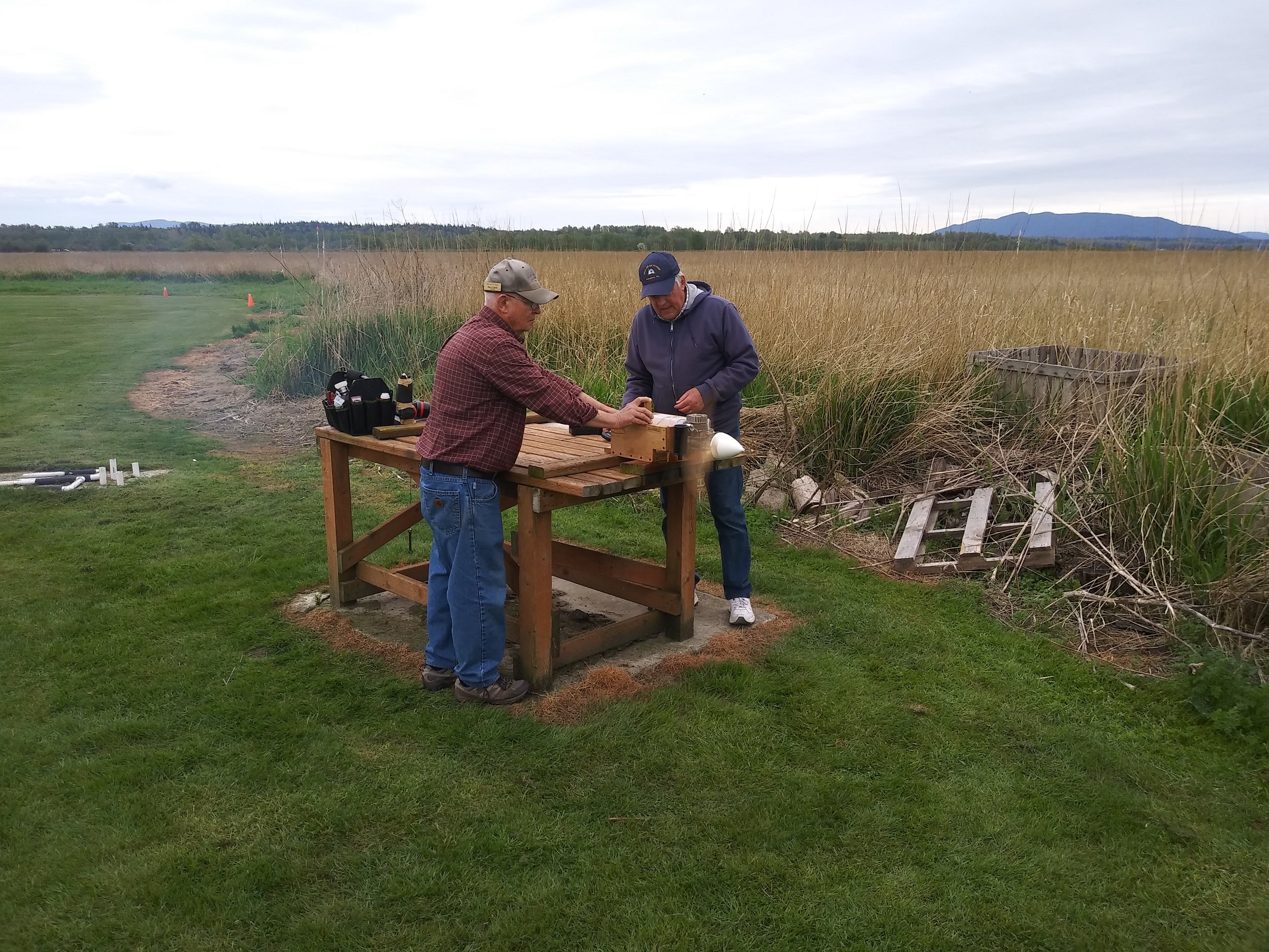 Rory Cahill and Bill Law tweaking a big engine on test stand.jpg