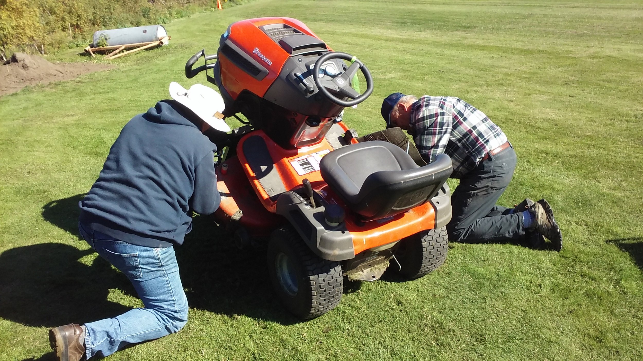 Art and Jay servicing lawn mower.jpg