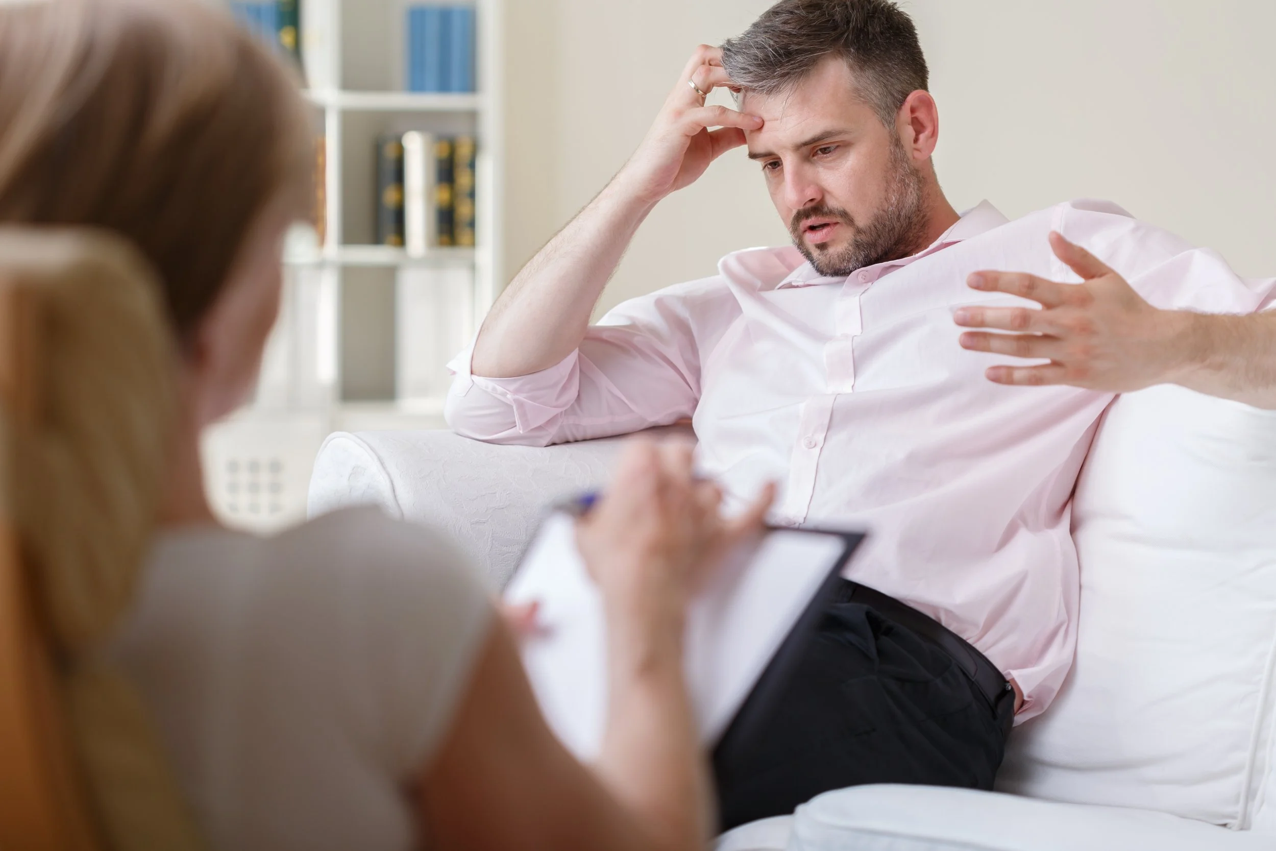 Man with anxiety talking to therapist