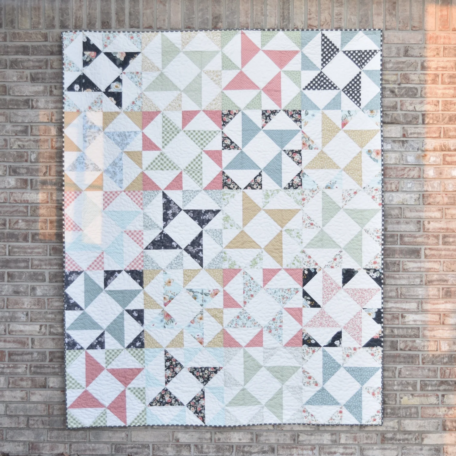 "Windmill" is a Free Layer Cake Quilt Pattern designed by Amanda from Material Girl Quilts!
