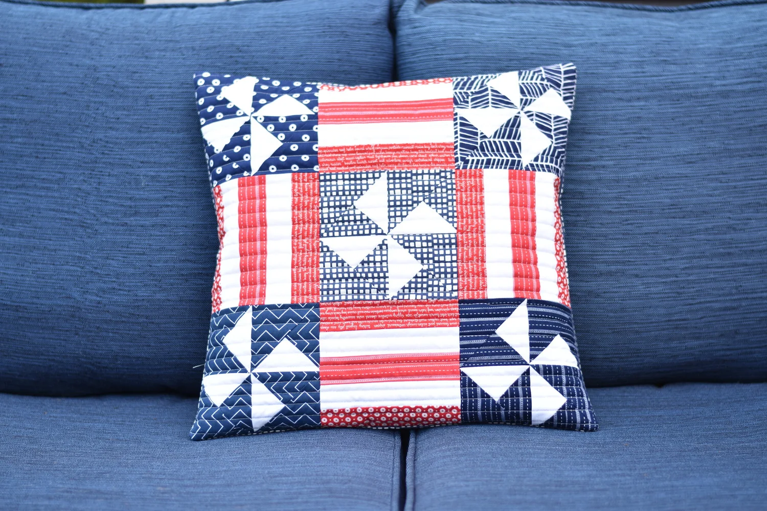 "Scrappy Quilted Patriotic Pillow” is a Free Quilted Pillow Pattern designed by Amanda from Material Girl Quilts!
