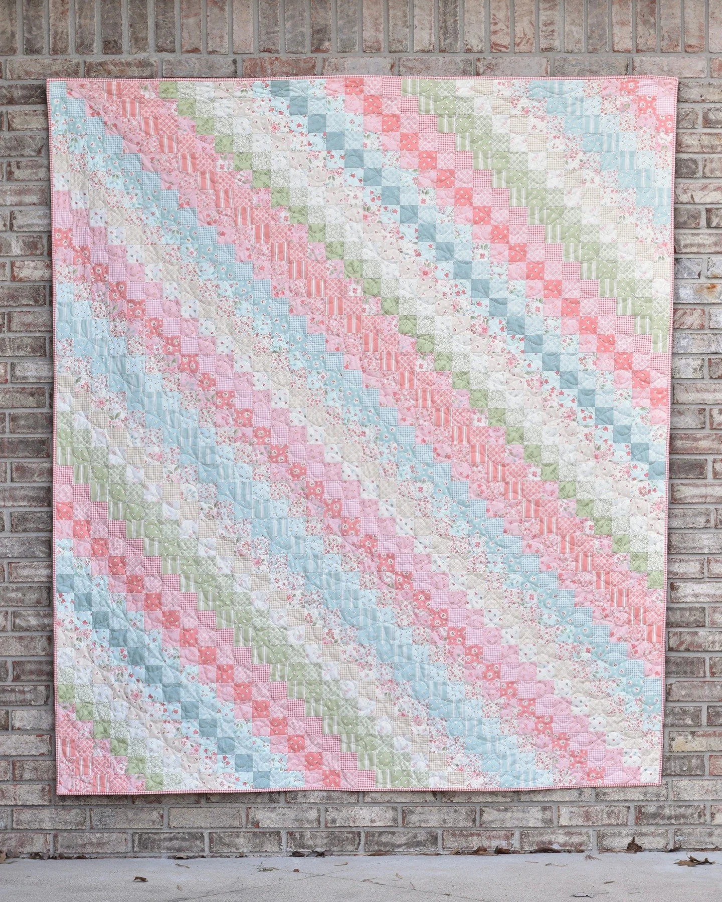 Who is already dreaming of spring?!?! 🙋🏼&zwj;♀️ This quilt has me wishing it was time to plant flowers and prepare for growth! 🌸⁠
⁠
Straight Trippin' is my latest pattern and I'm in love.  All you need to create this 68" x 80" quilt top 