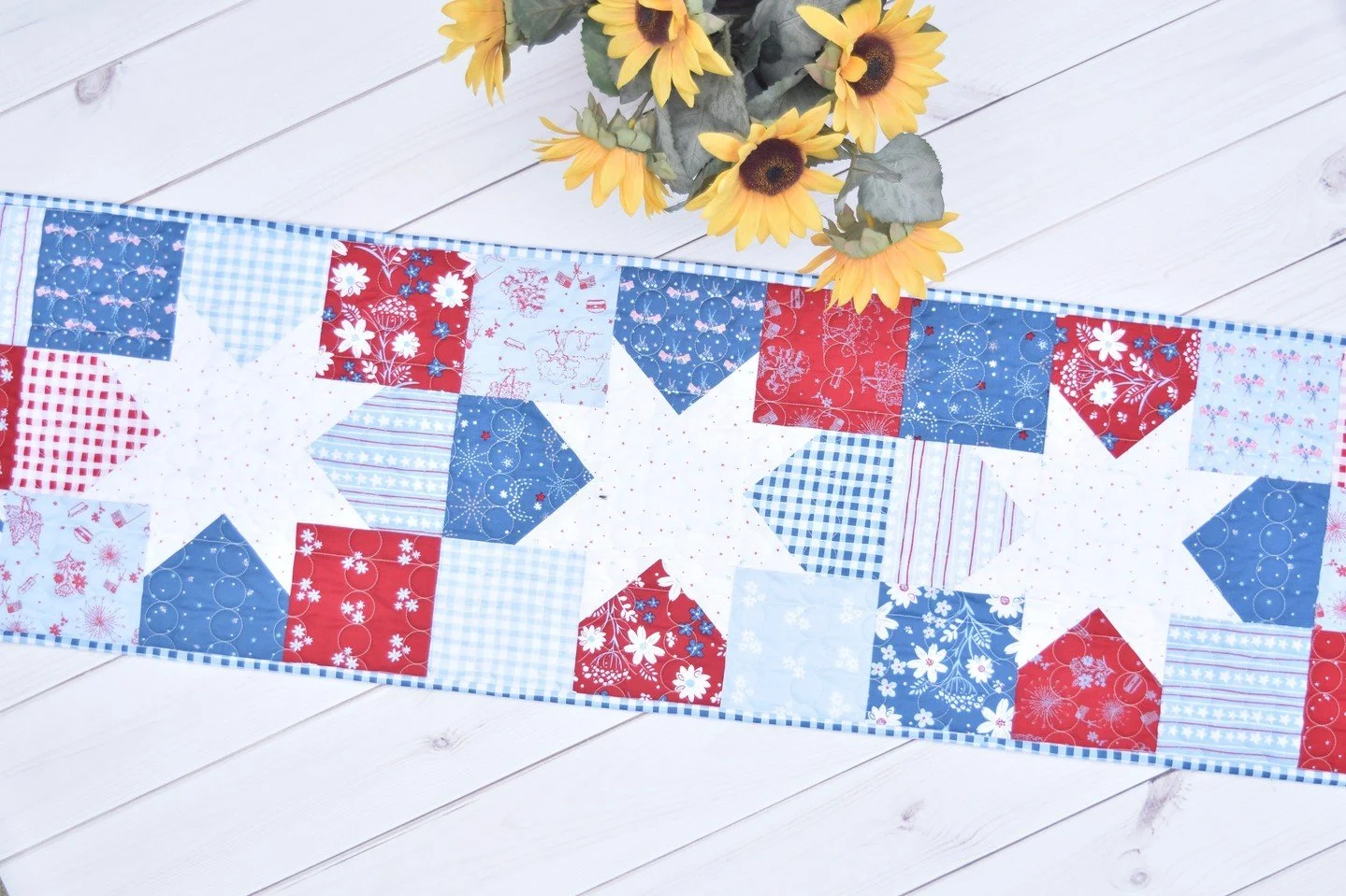 Always a fan of red, white and blue quilts ❤️⁠🤍💙 and this cute table runner is perfect for your summer decor.⁠
⁠
Star Charms is a quick finish and with 1 charm pack and some background fabric, you can have this whipped together in a day!⁠
⁠
Fabric: