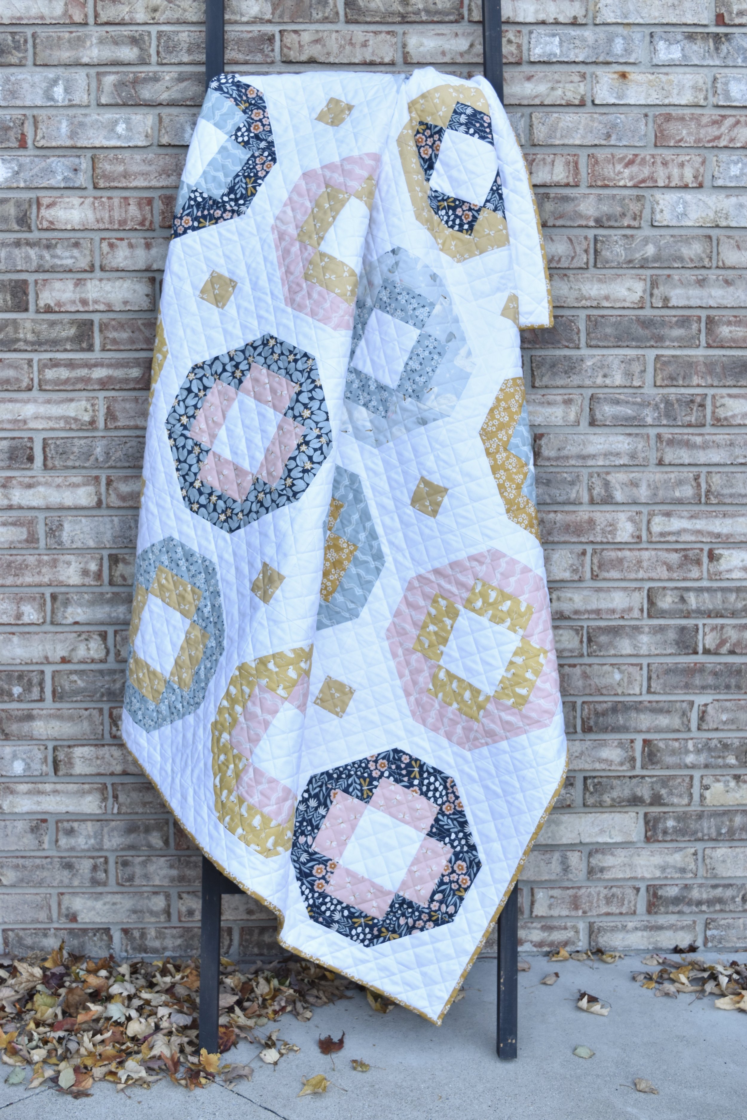 Crossroads+quilt+on+ladder.jpeg