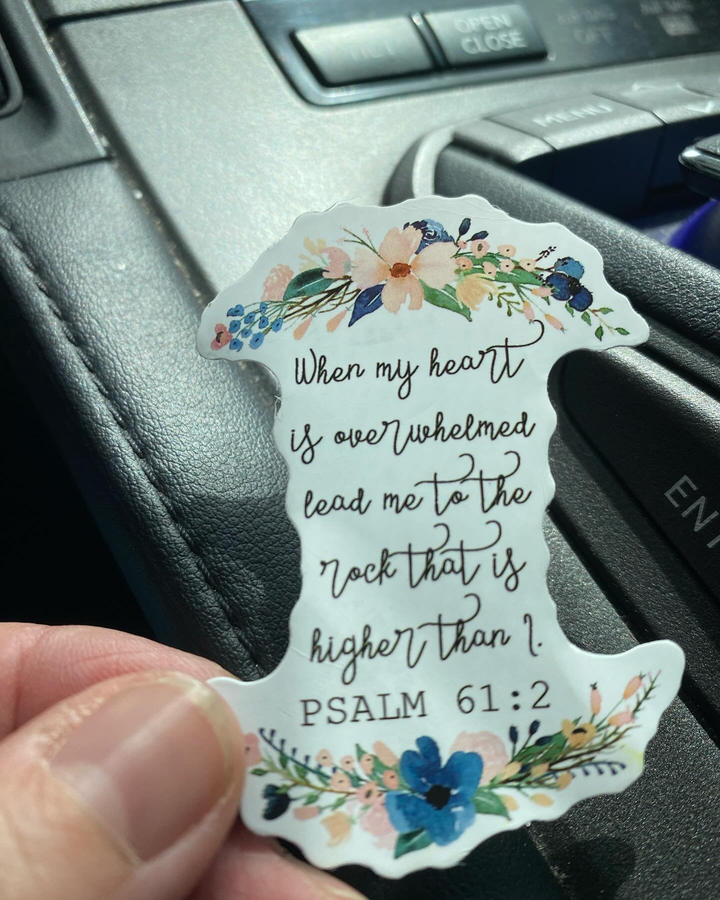 I was flustered. A number of circumstances had colluded that created a bit of a perfect storm. As I leaped into the car, hoping that I had everything I needed for my next appointment, this sticker fell out of my knapsack onto my lap.  I had picked it