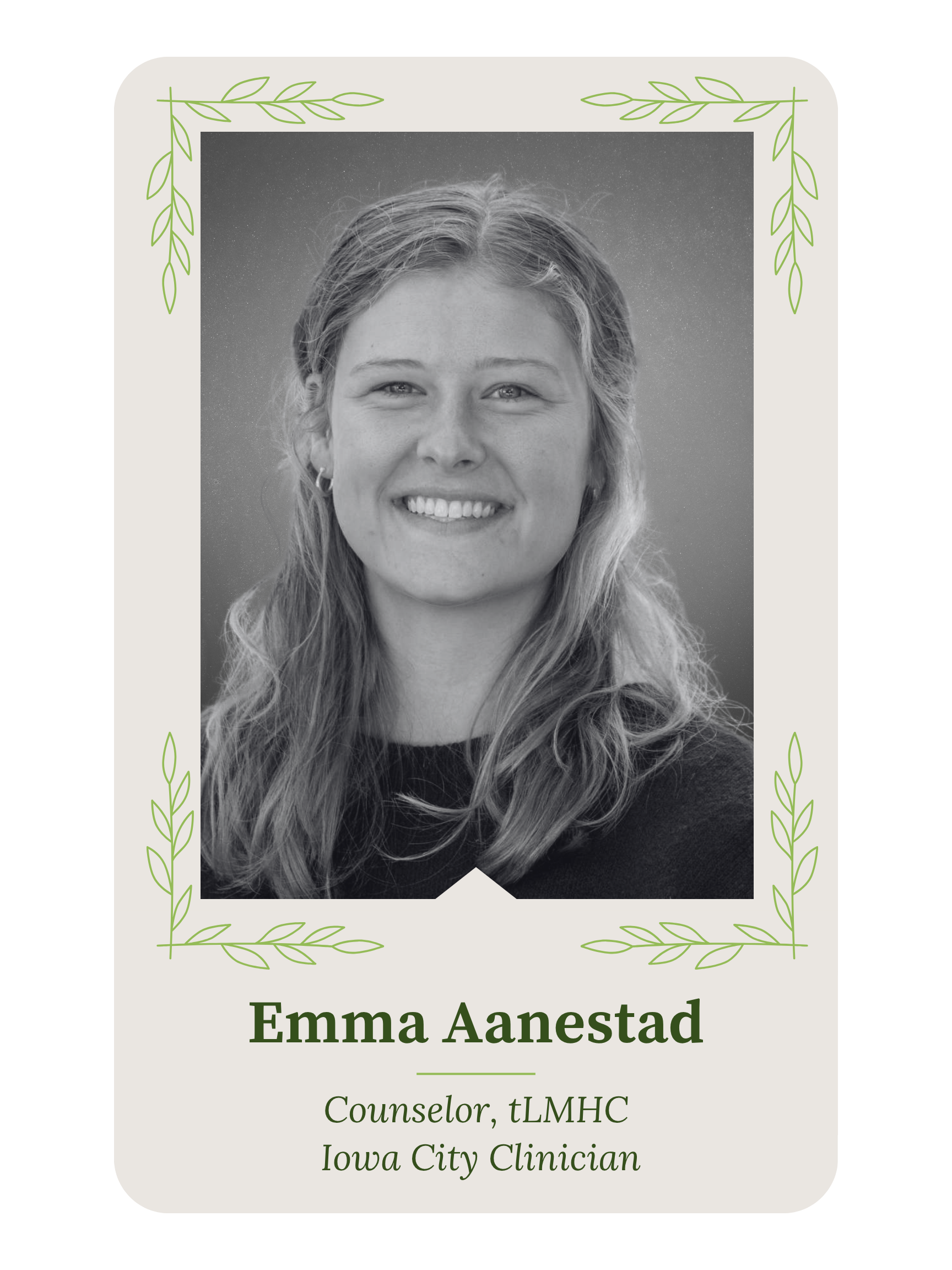 A professional name tag featuring a black-and-white photo of a woman with long, wavy hair smiling, surrounded by a decorative green leaf border. The name on the tag is Emma Anastad, who is identified as a counselor, tLMHC, and Iowa City clinician.