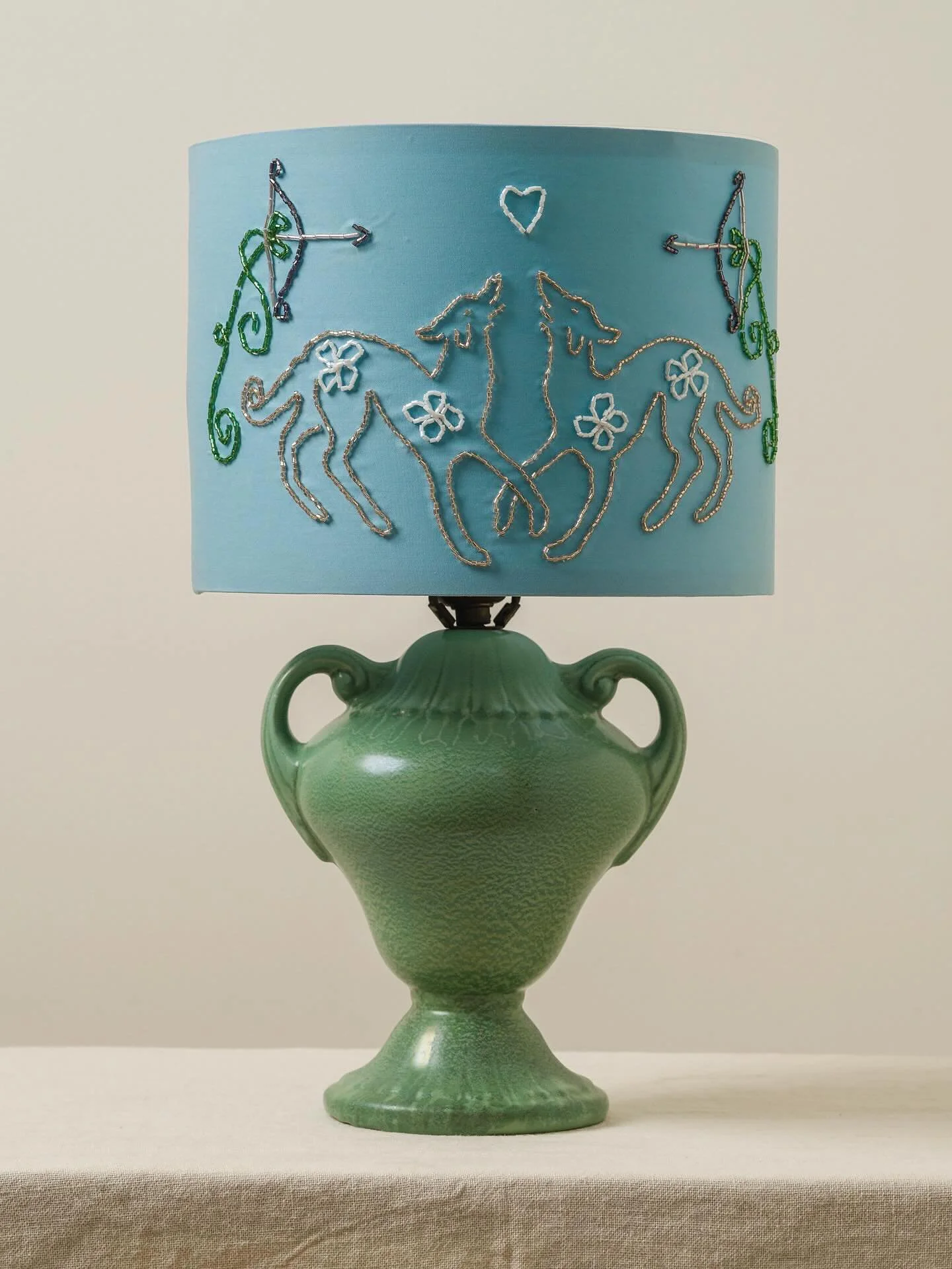 🏹 𝑾𝒆𝒏𝒅𝒚&rsquo;𝒔 𝑭𝒓𝒐𝒍𝒊𝒄 🏹
Handmade embroidered cotton and glass-beaded lampshade with vintage ceramic base, c. 1940s

On view now at @studio_solenne
First image by @simonleungphoto