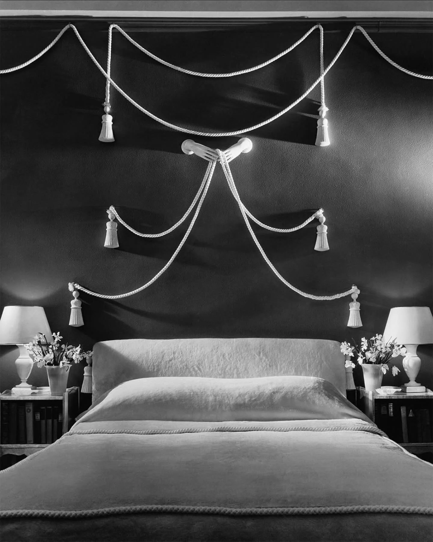 The softly surreal bedroom of actress Rose Hobart, decorated by Joseph Mullen. White ropes draped in soft curves above the bed, finished with carved wooden tassels and held by porcelain hands.

Via @condenastarchive