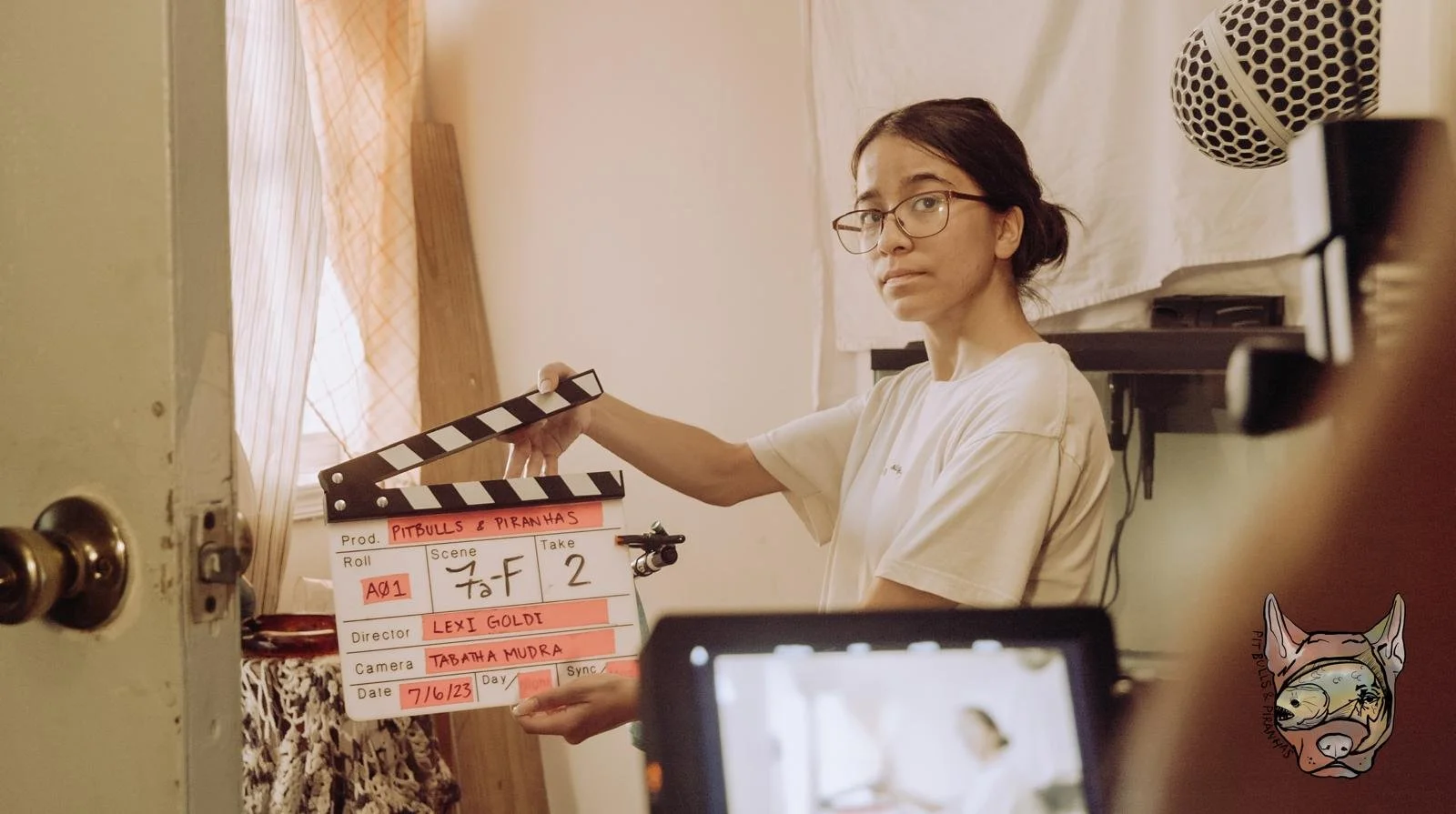 Mimi Midori holding a clapperboard.jpeg