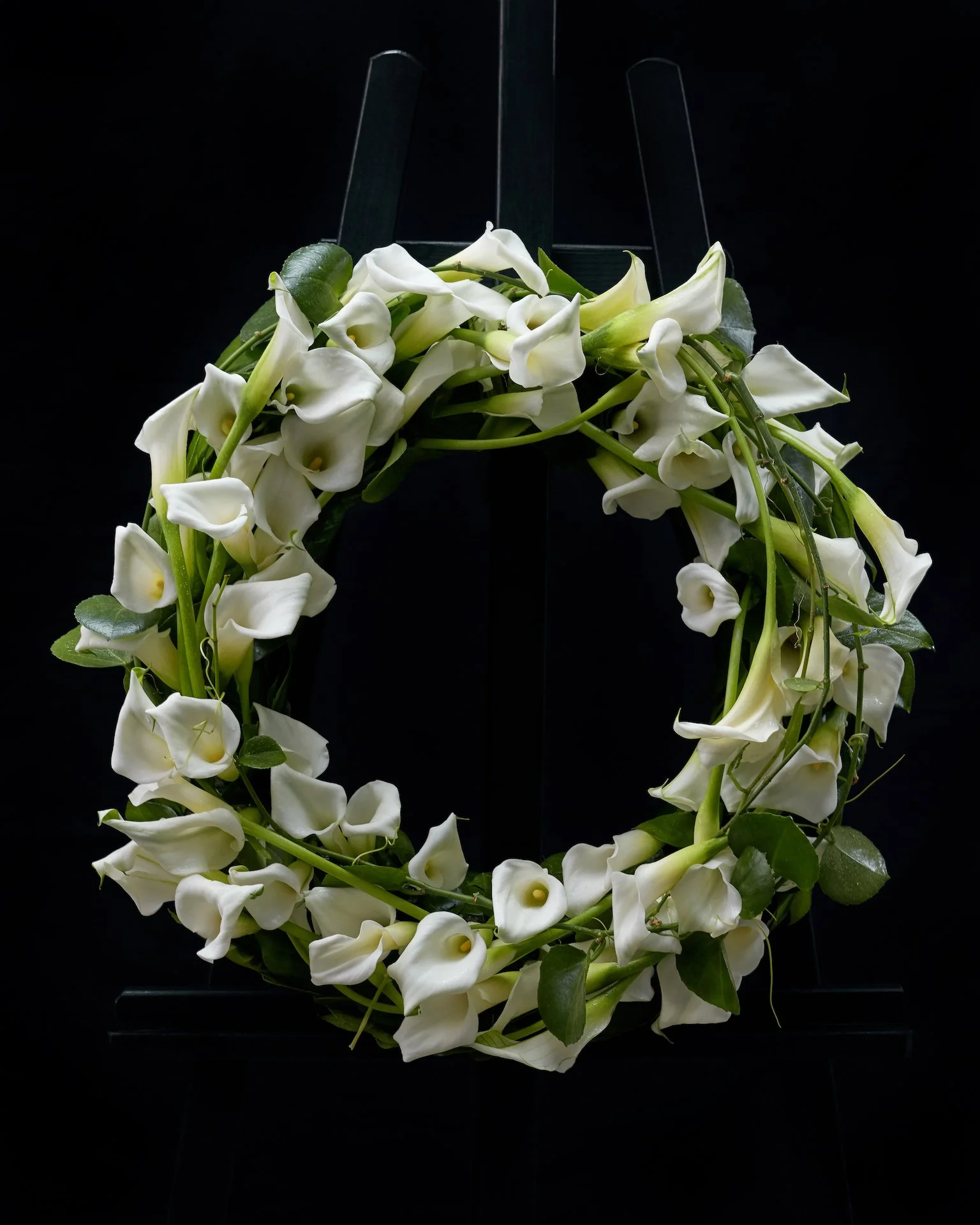 A funeral wreath of calla lilies