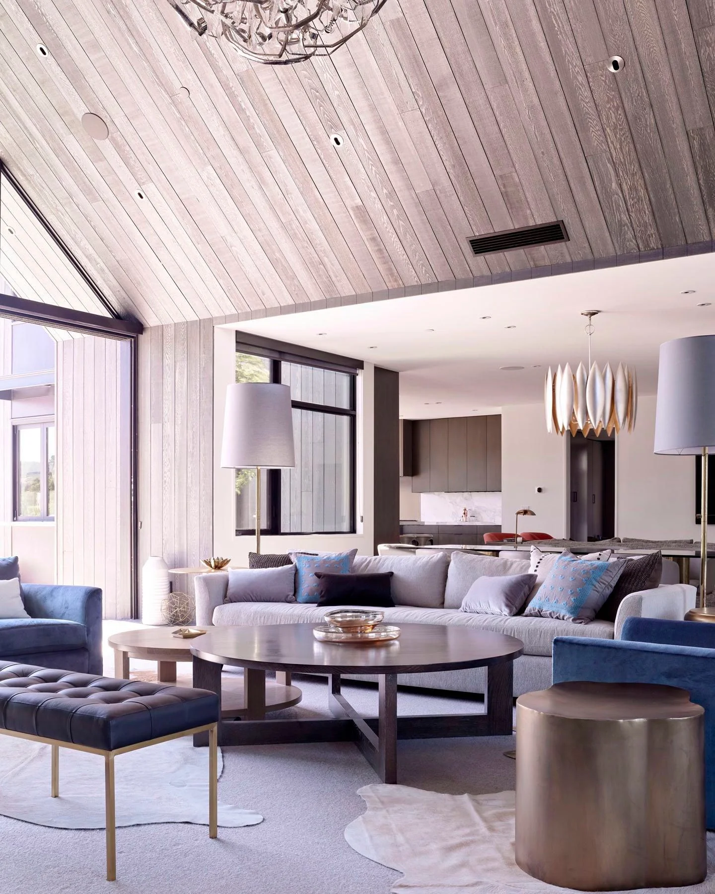 wood paneled ceiling and walls in living room