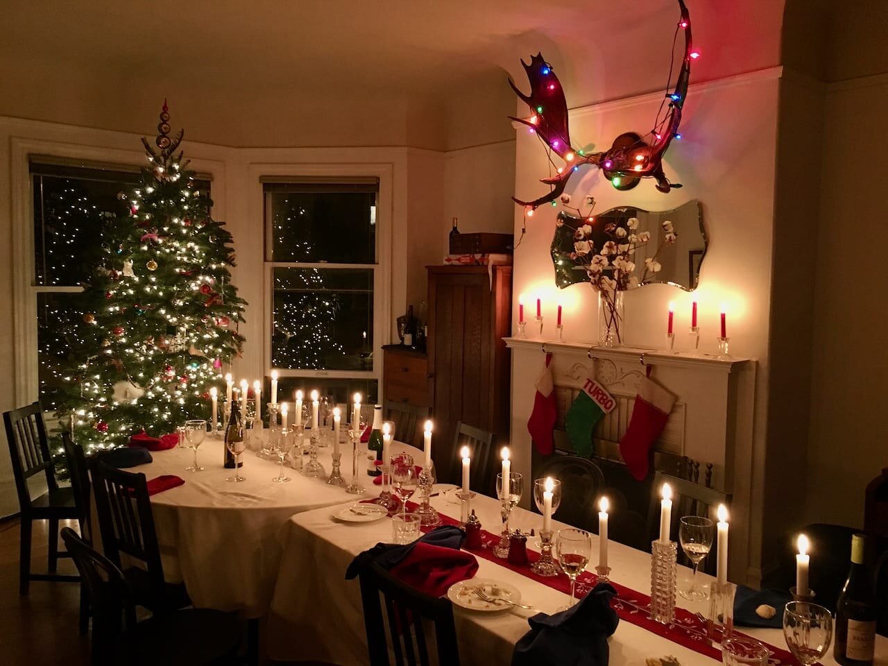 Living room festively decorated for a large family Christmas dinner