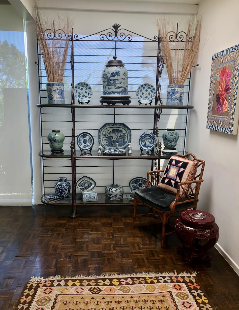 Antique French iron and brass bread rack with glass shelves, circa 1840. Client’s collection of Chinese and Japanese Blue &amp; White Celadon porcelain.