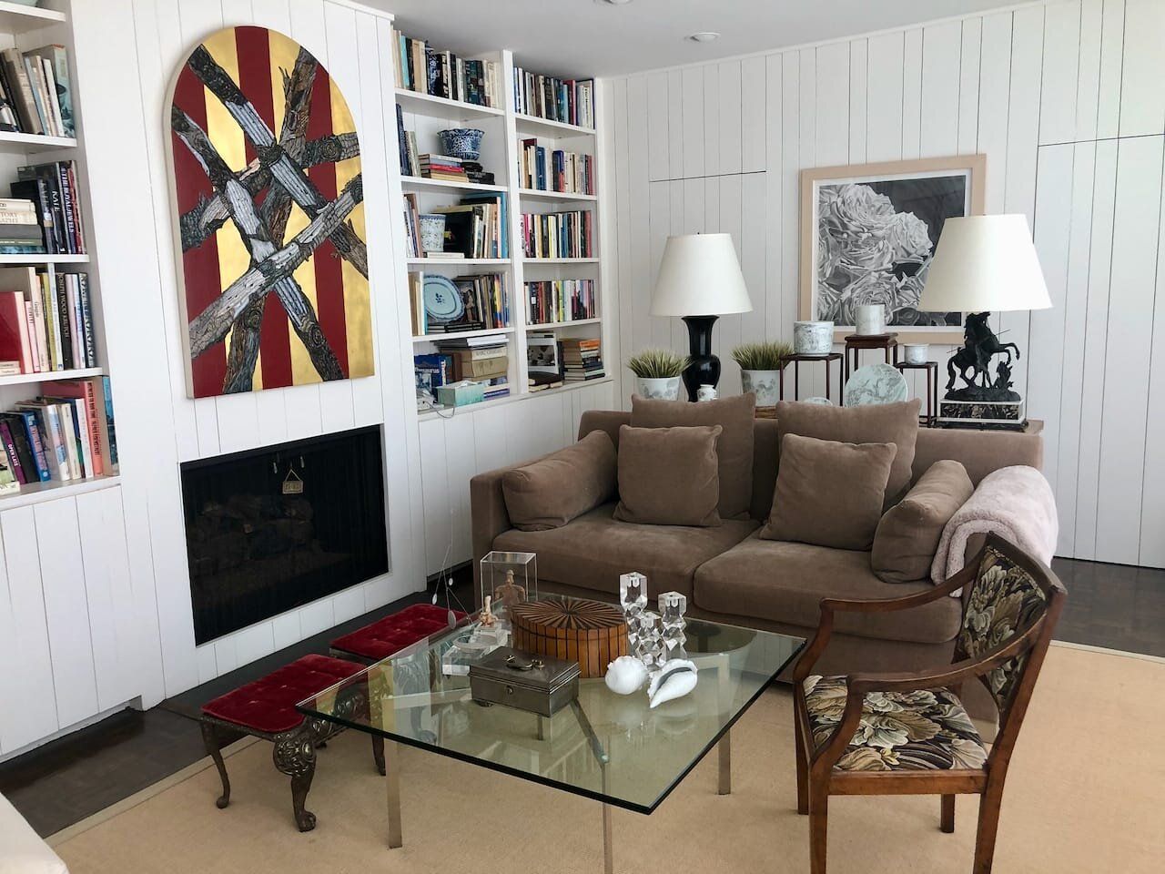 Barcelona table by Mies van der Rohe. Antique Italian open arm chair, circa 1800.