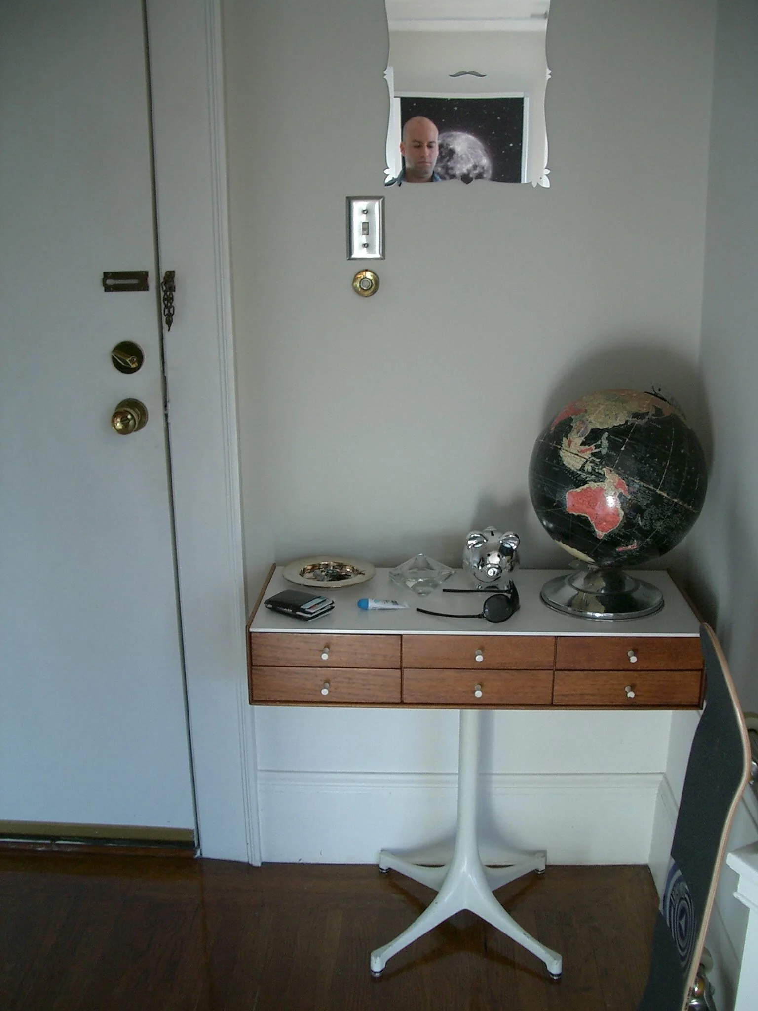 Entryway has vintage George Nelson Miniature Chest and vintage globe both from Alameda Antique Fair.