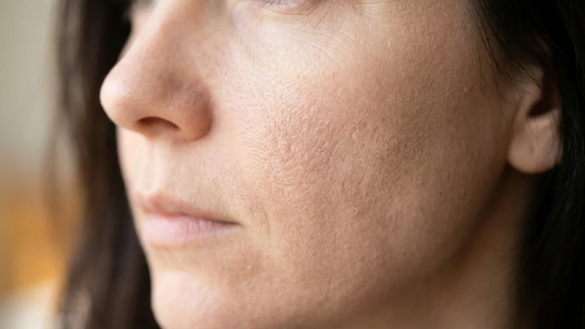 Esthetician applying chemical peel treatment at boutique facial studio in Kirkland WA