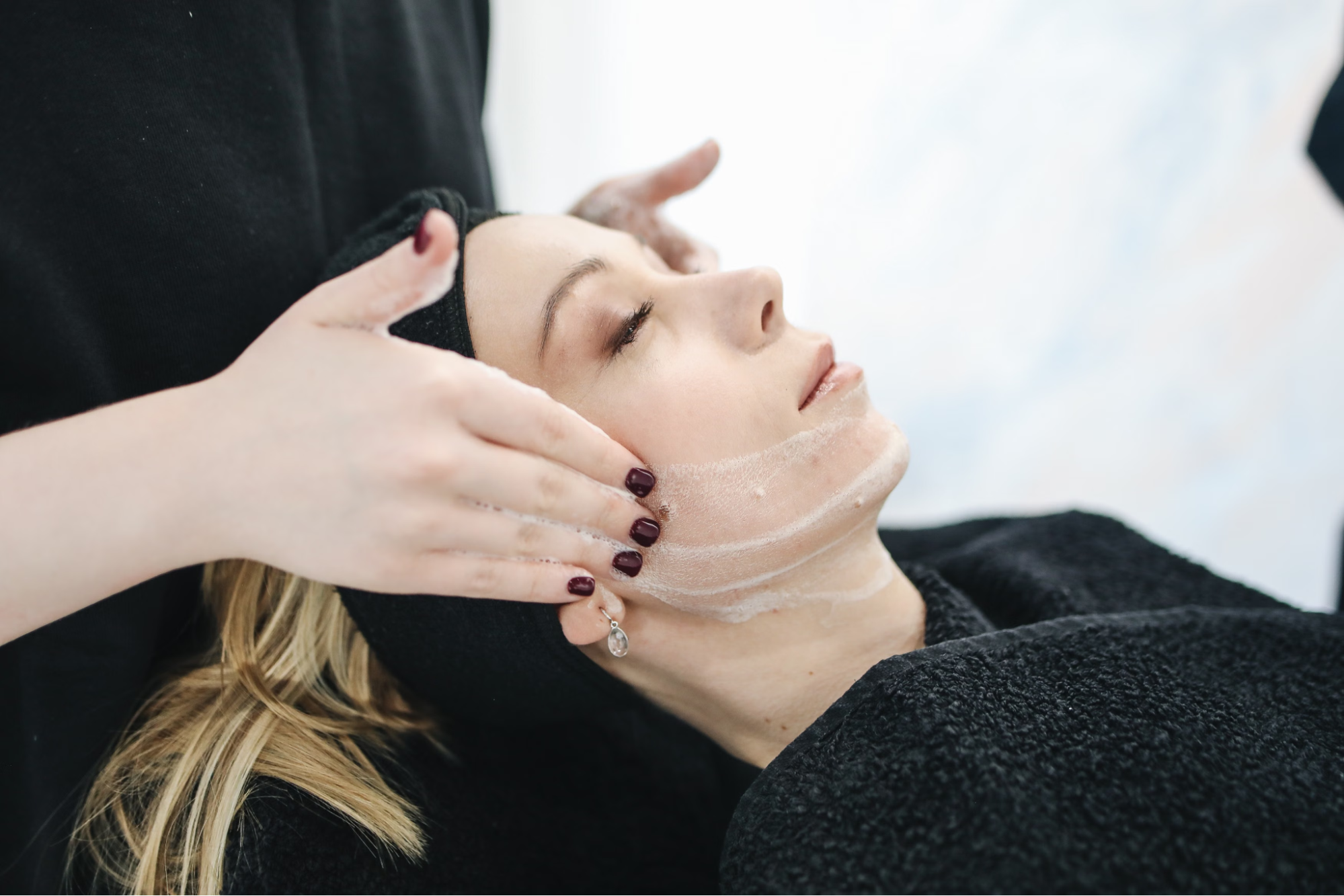 A client is receiving a professional facial