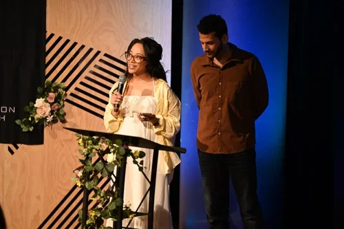 Reflection Church leaders speaking at a community event in Pasadena, California.