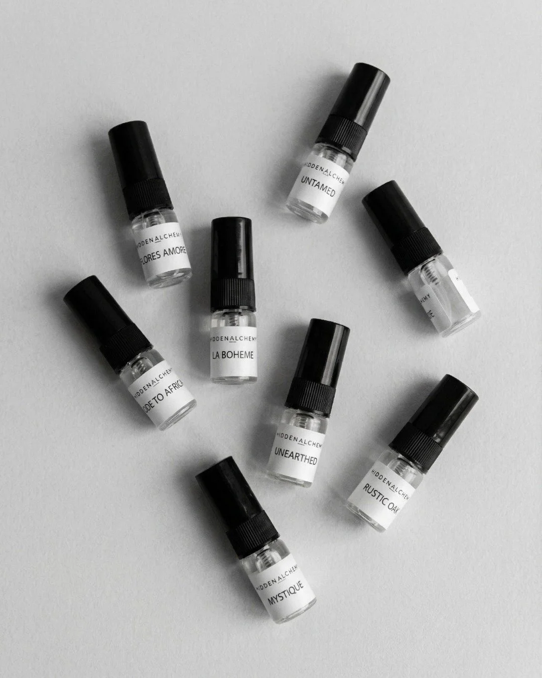 Eight worlds in one collection.

Flores Amore. Untamed. La Boheme. Mystique. Ode to Africa. Unearthed. Rustic Oak. And one more waiting to be discovered.

The Hidden Alchemy Discovery Set &mdash; try all eight before you choose your forever scent. 🖤