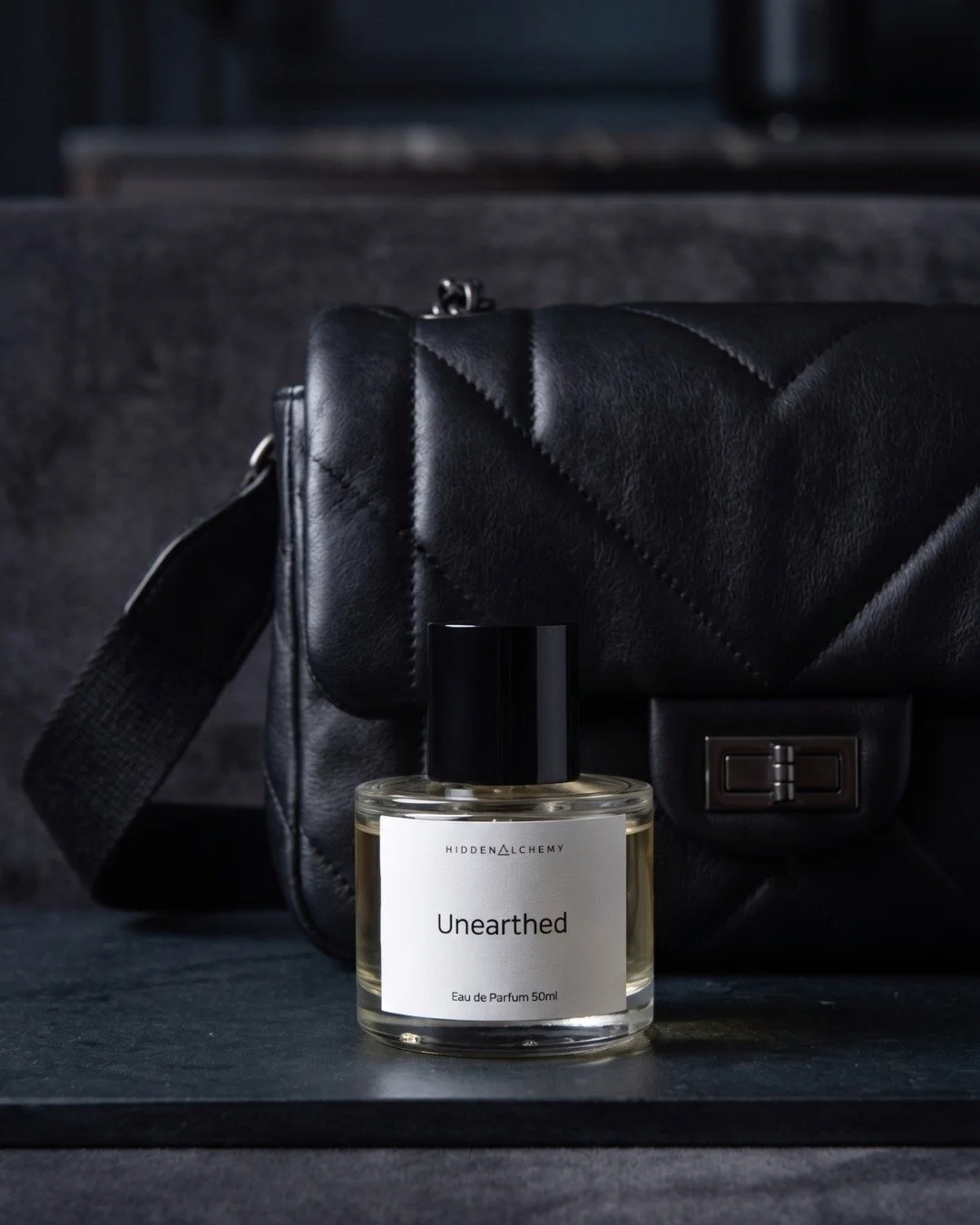 The bag is giving. The scent is giving more.

Unearthed, a scent lingers long after you've left the room. 
The kind of fragrance that makes your whole outfit make sense ;)