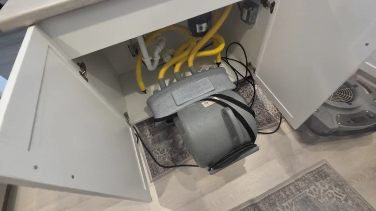 Targeted cabinet drying after a kitchen leak was stopped