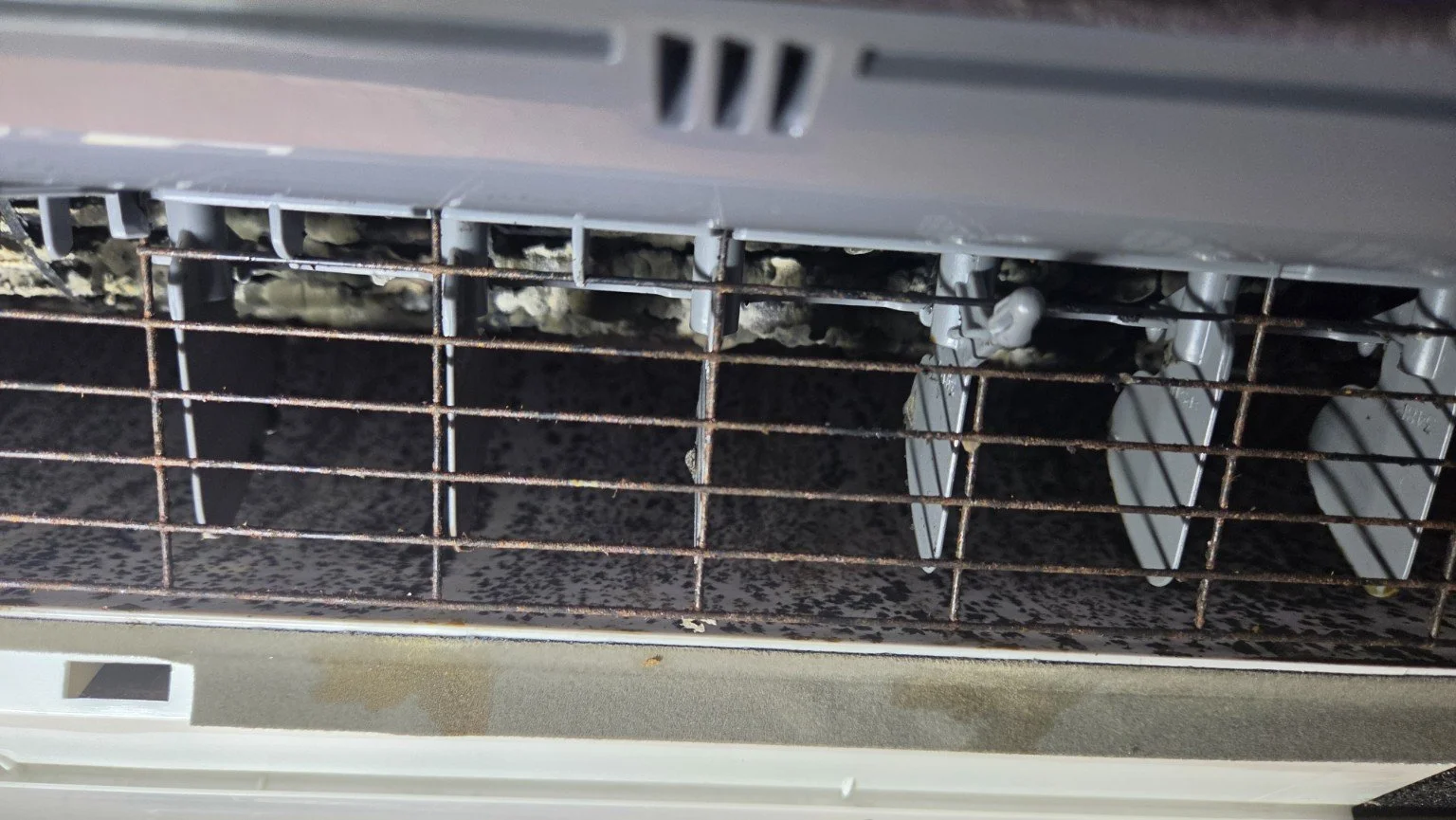 Before cleaning: visible buildup inside a mini-split indoor unit in Fort Lauderdale, Florida.