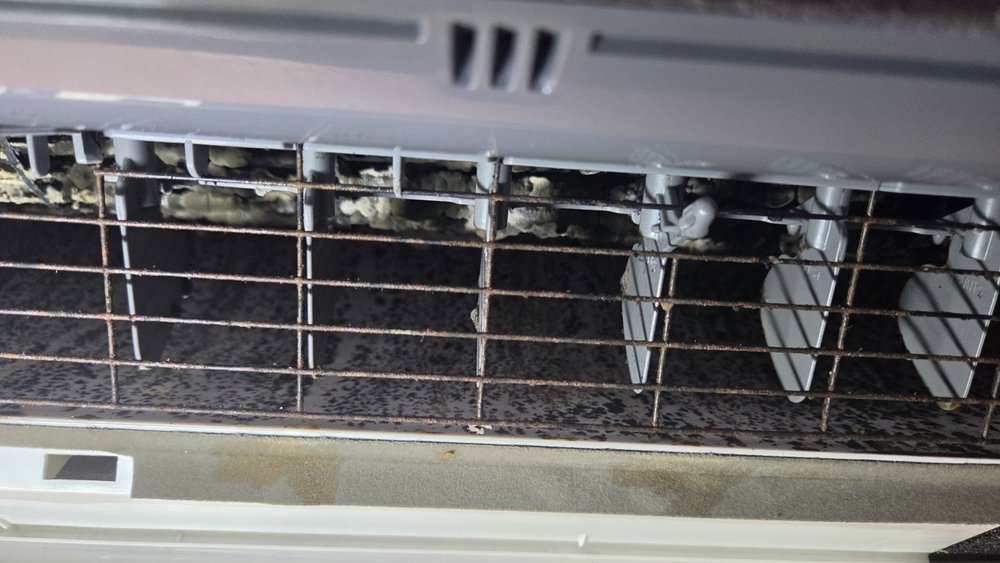 Before cleaning: visible buildup inside a mini-split indoor unit in Fort Lauderdale, Florida.
