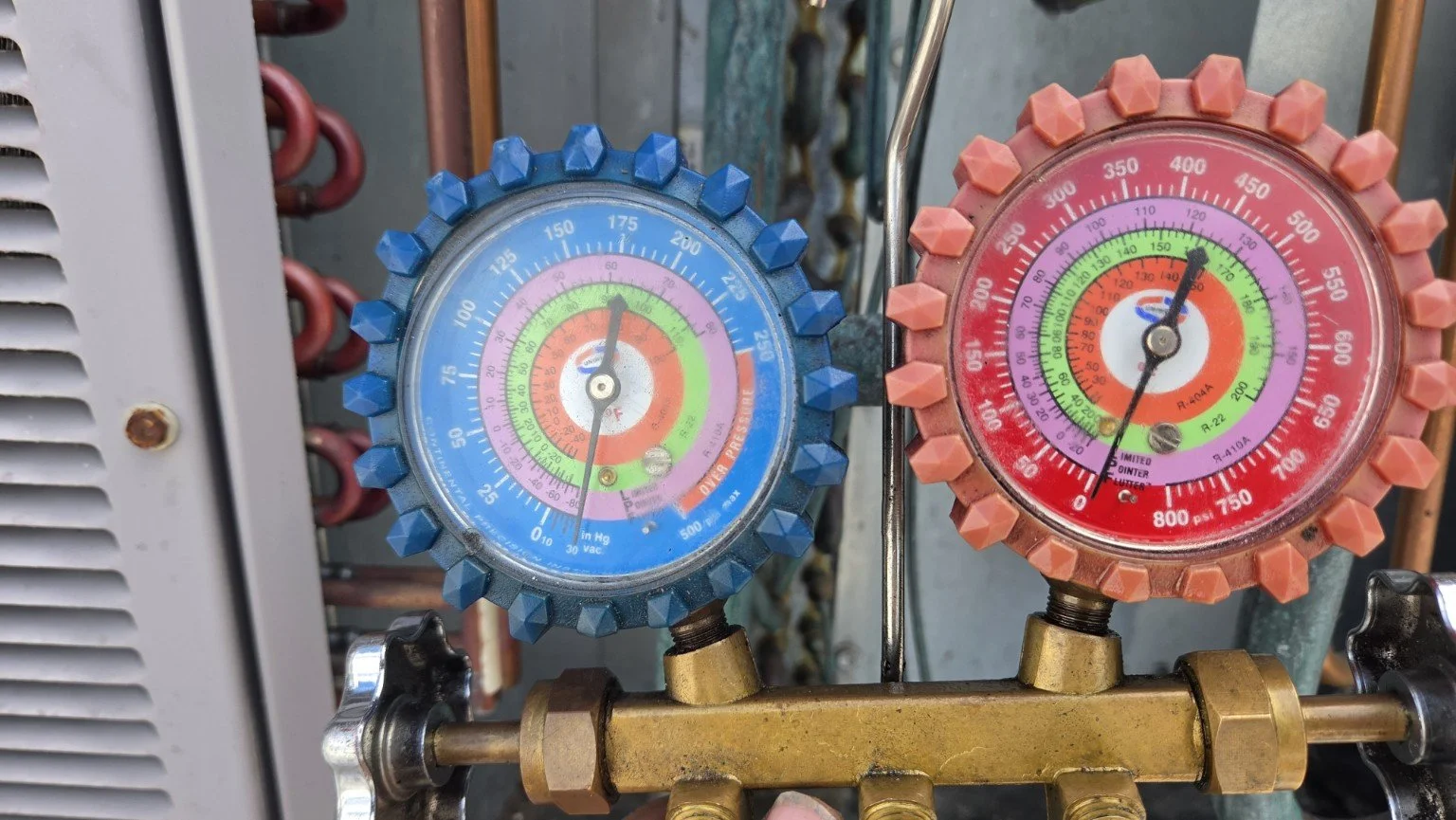 Refrigerant gauges connected during commercial package AC compressor replacement in Plantation, Florida.