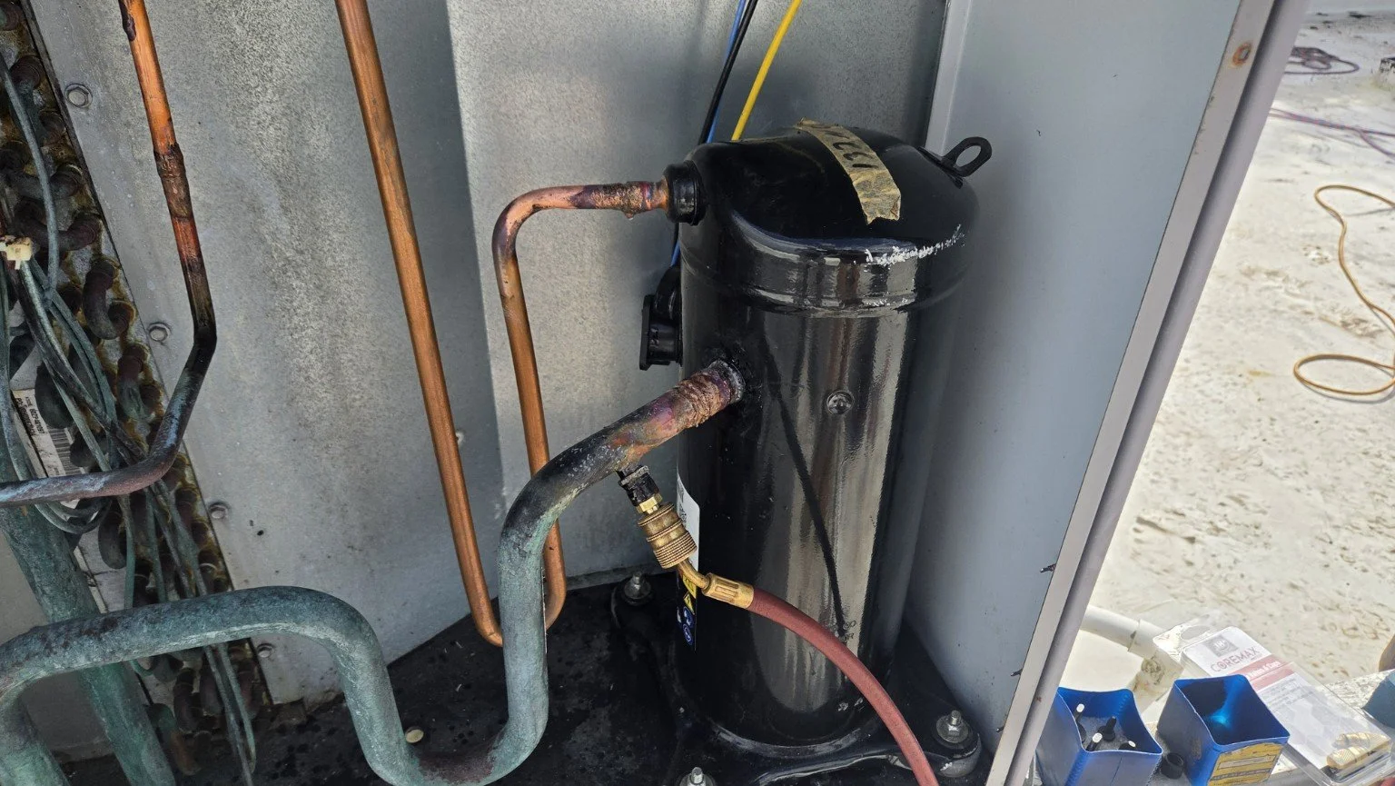 Replacement compressor installed in the commercial package AC unit in Plantation, Florida.
