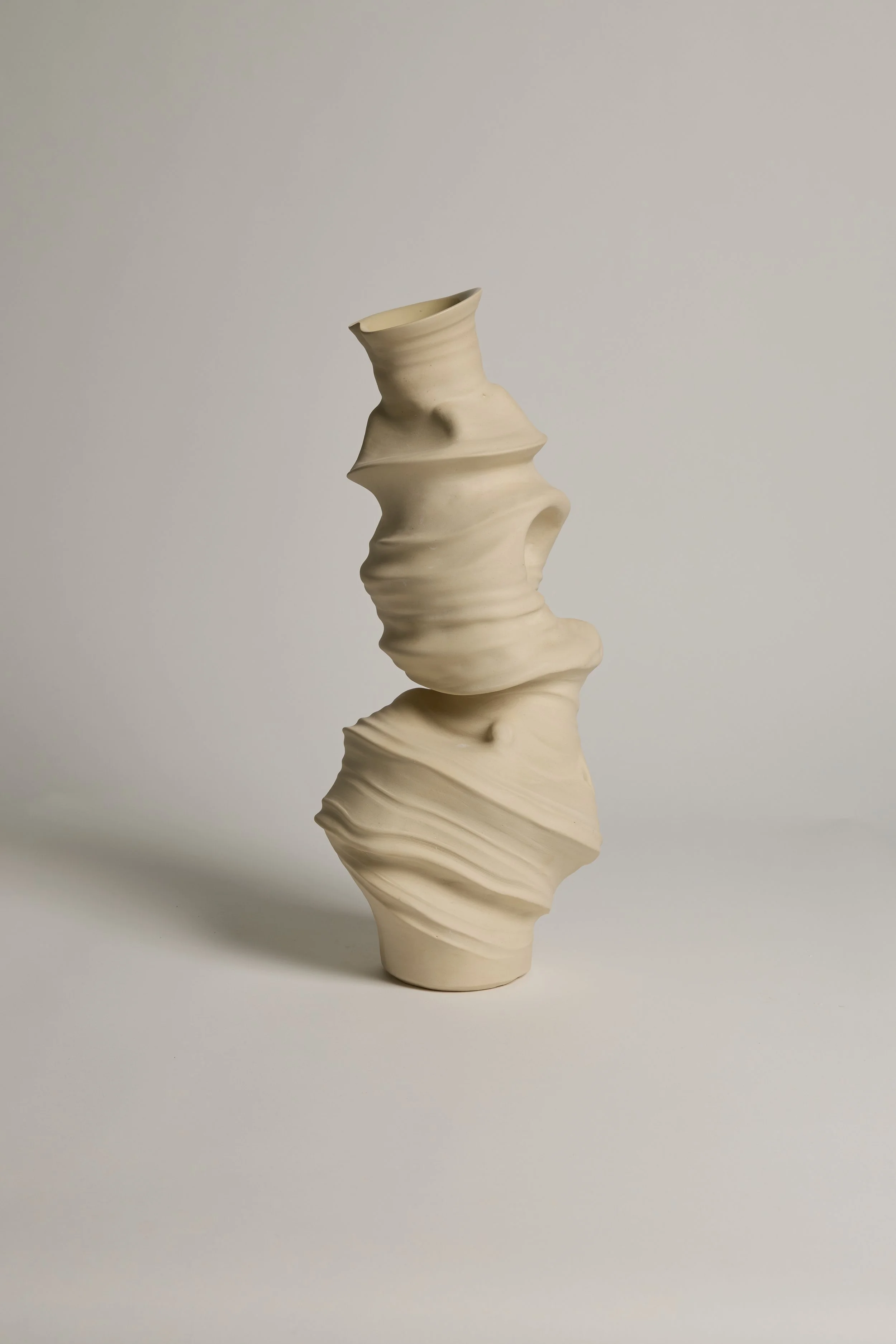 Abstract ceramic sculpture by Melbourne ceramic artist Alyssa Nuttall. Organic form inspired by erosion and changing coastal landscapes.