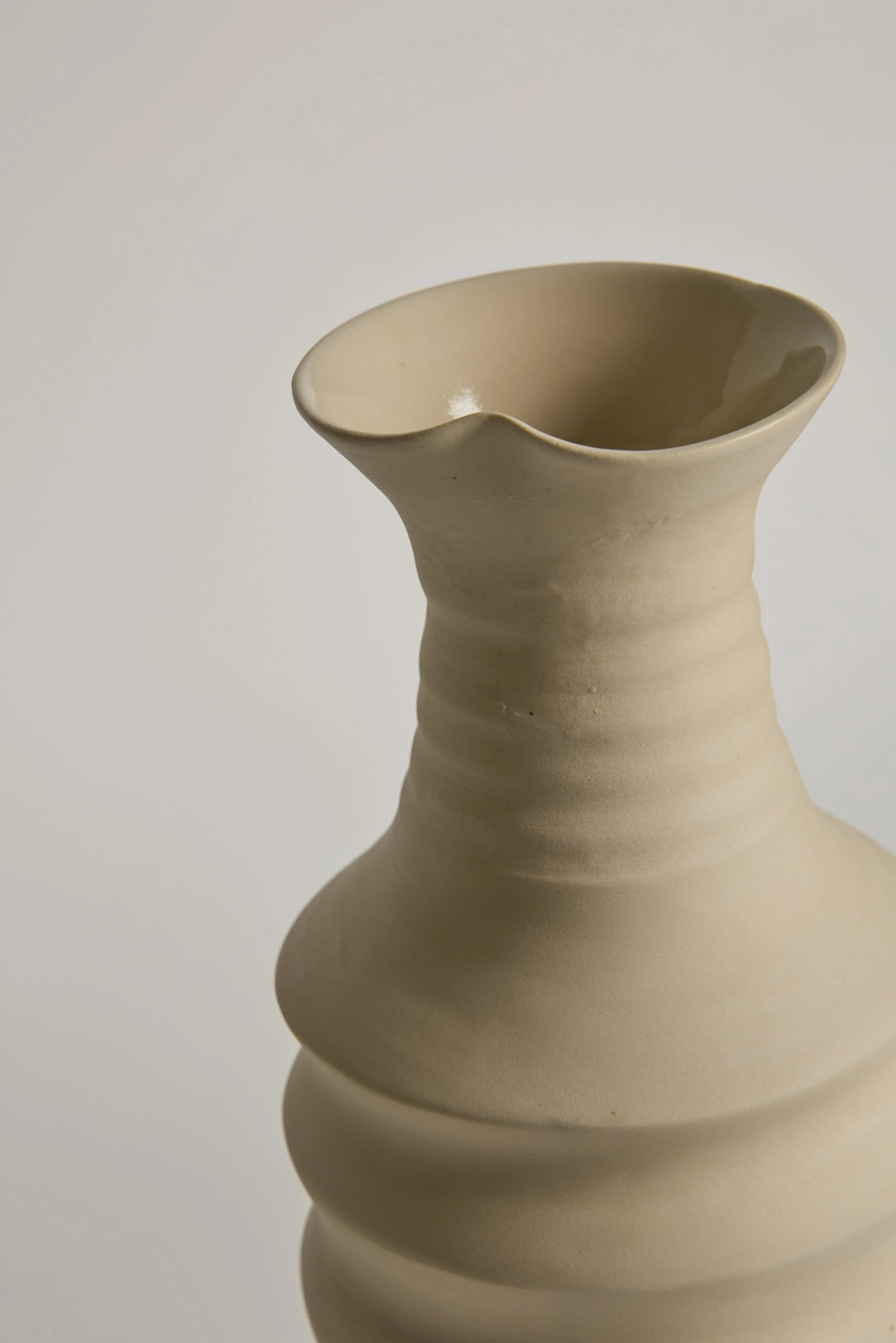Close-up of an abstract ceramic sculpture by Melbourne ceramic artist Alyssa Nuttall. Organic form inspired by erosion and changing coastal landscapes.