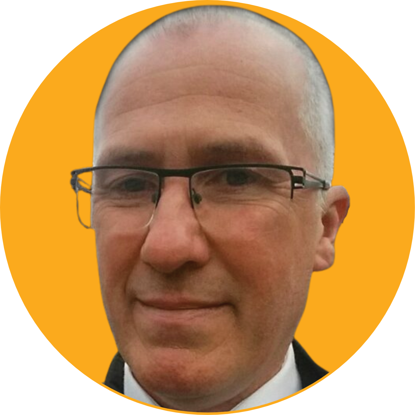 Close-up of a smiling man with glasses against a yellow circular background.