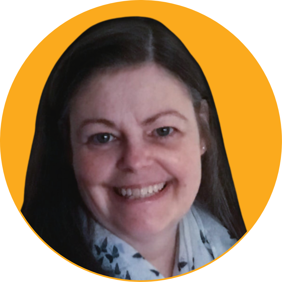 Smiling woman with dark hair and light skin, wearing a patterned blouse, against a yellow background.