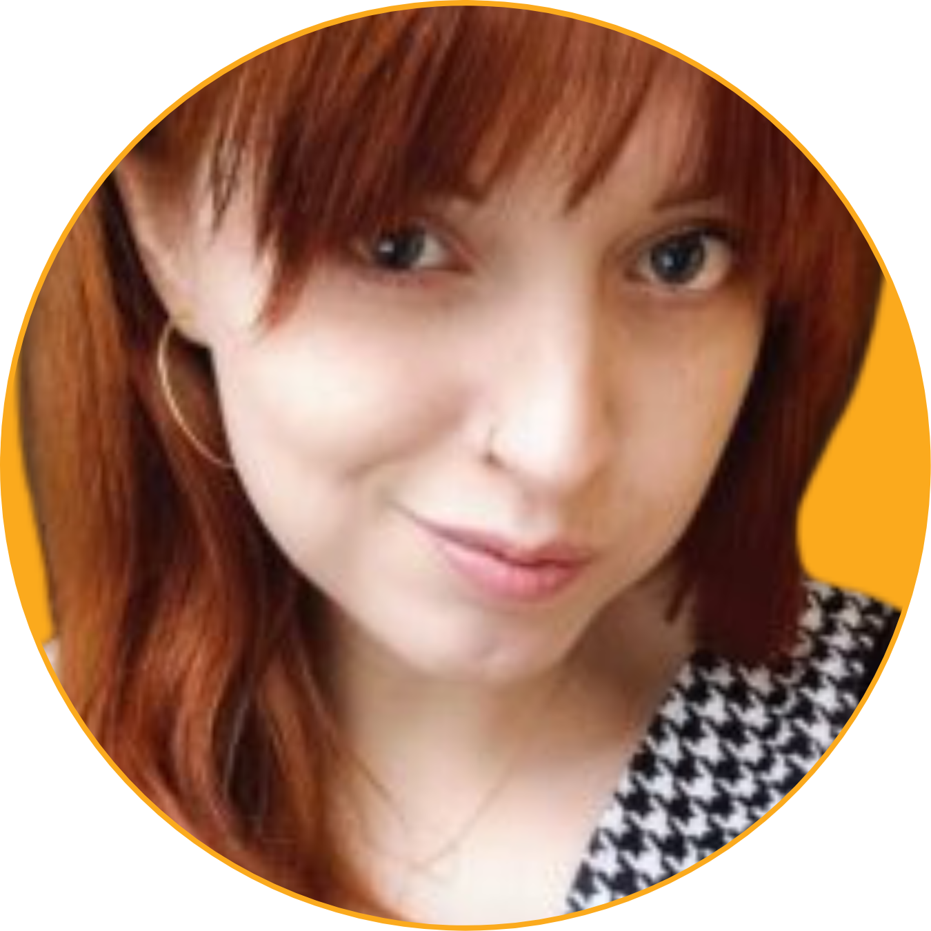 Close-up of a woman with red hair wearing a checkered top against a yellow background.