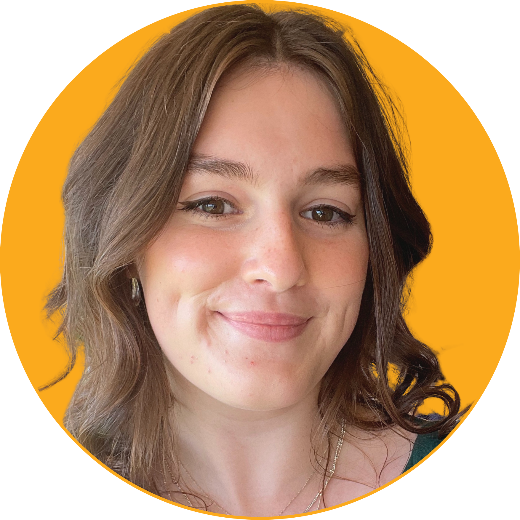Close-up portrait of a woman with wavy brown hair, smiling, against a bright orange circular background.