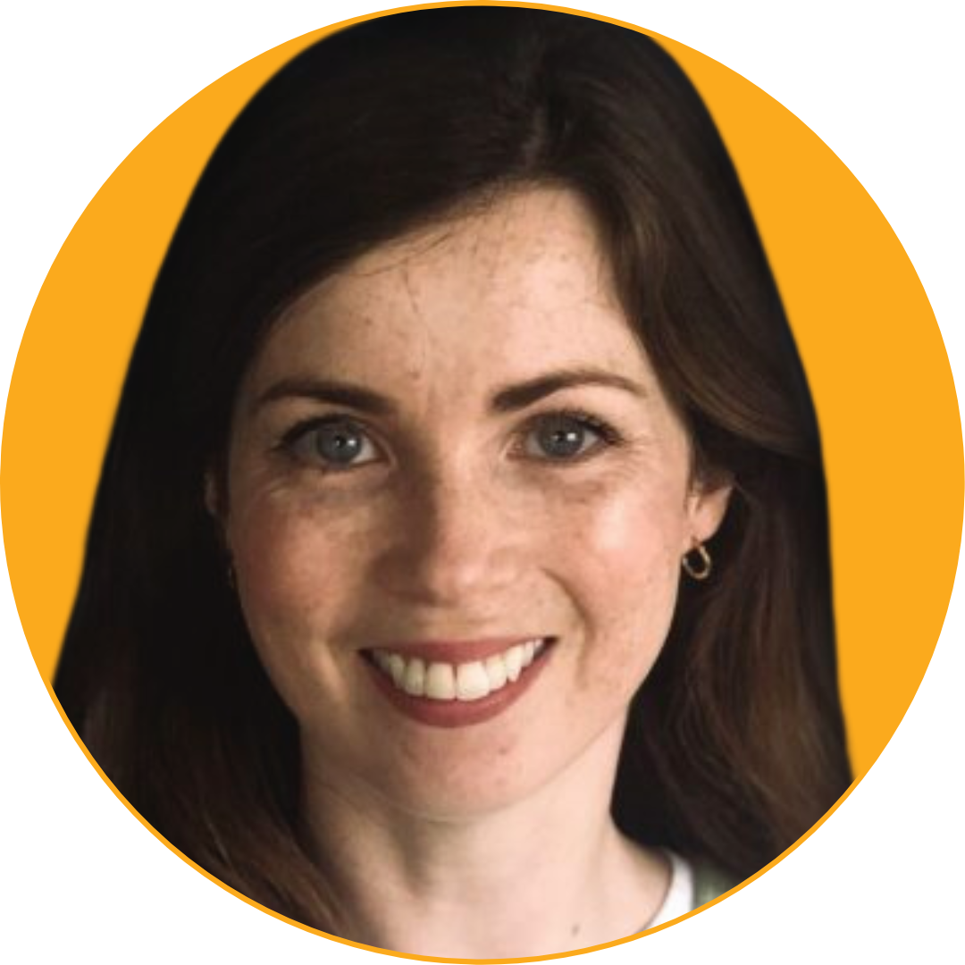 Close-up of a smiling woman with dark hair and blue eyes, against a yellow background.