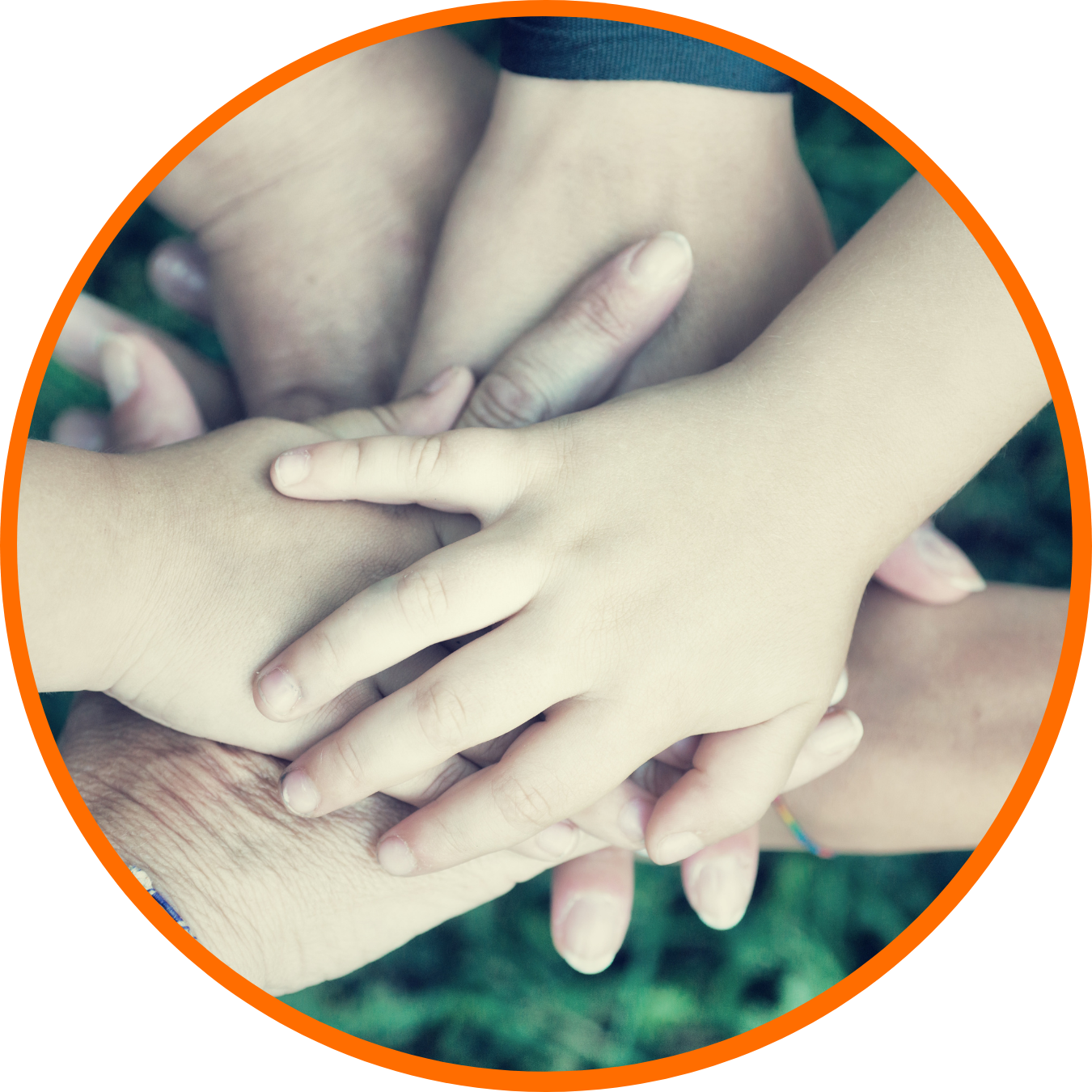 Multiple hands and arms of different ages overlapping in a circular formation, symbolizing unity and diversity.