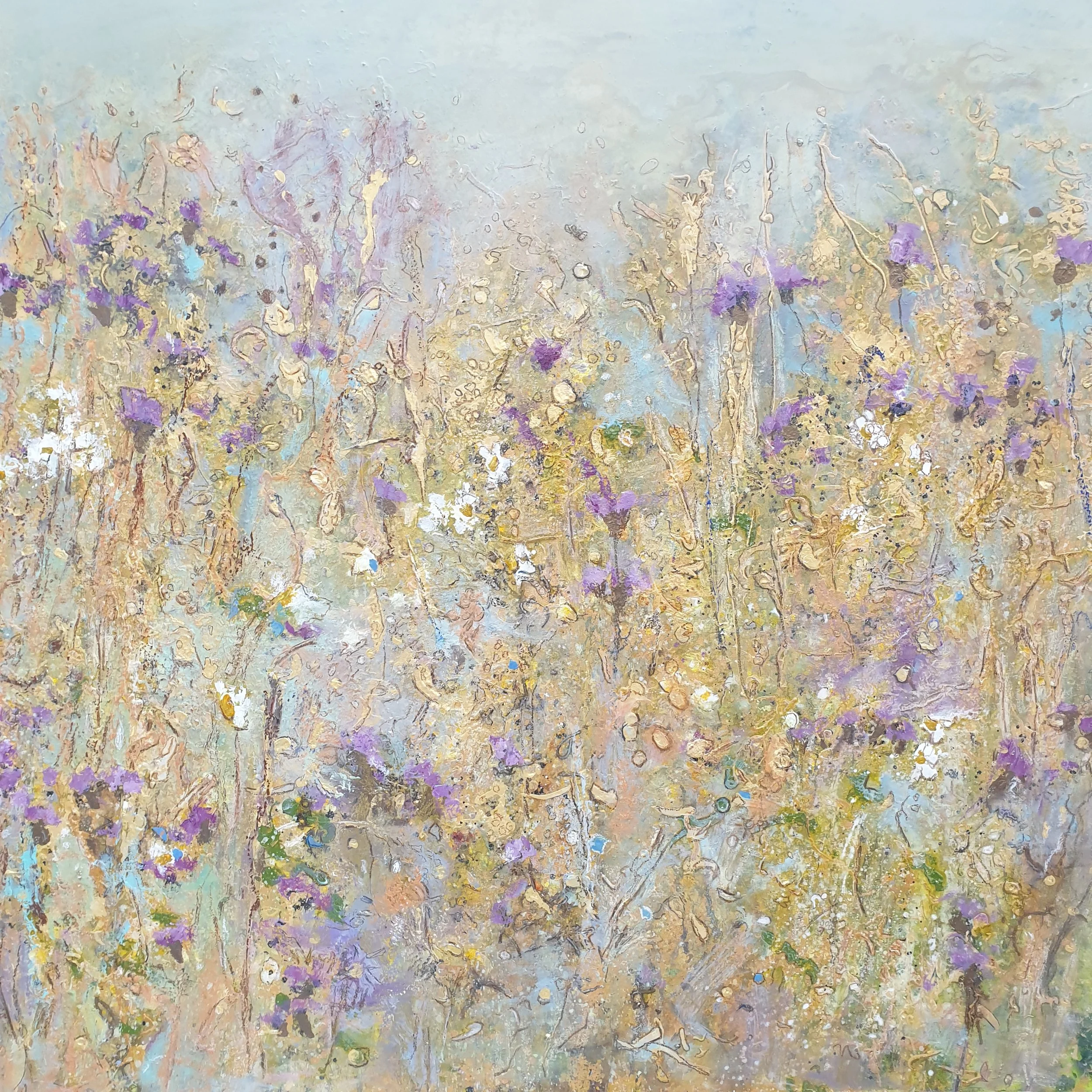 Mixed-media meadow painting with layered marks in pale blue, ochre, lilac and green, suggesting grasses and wildflowers across a textured surface.