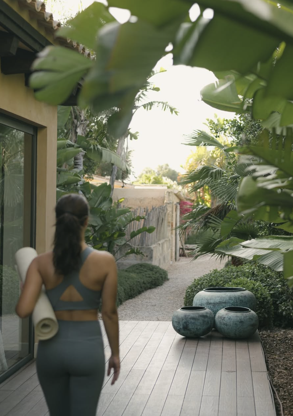 CAlreit girl in the garden w yoga mat.png