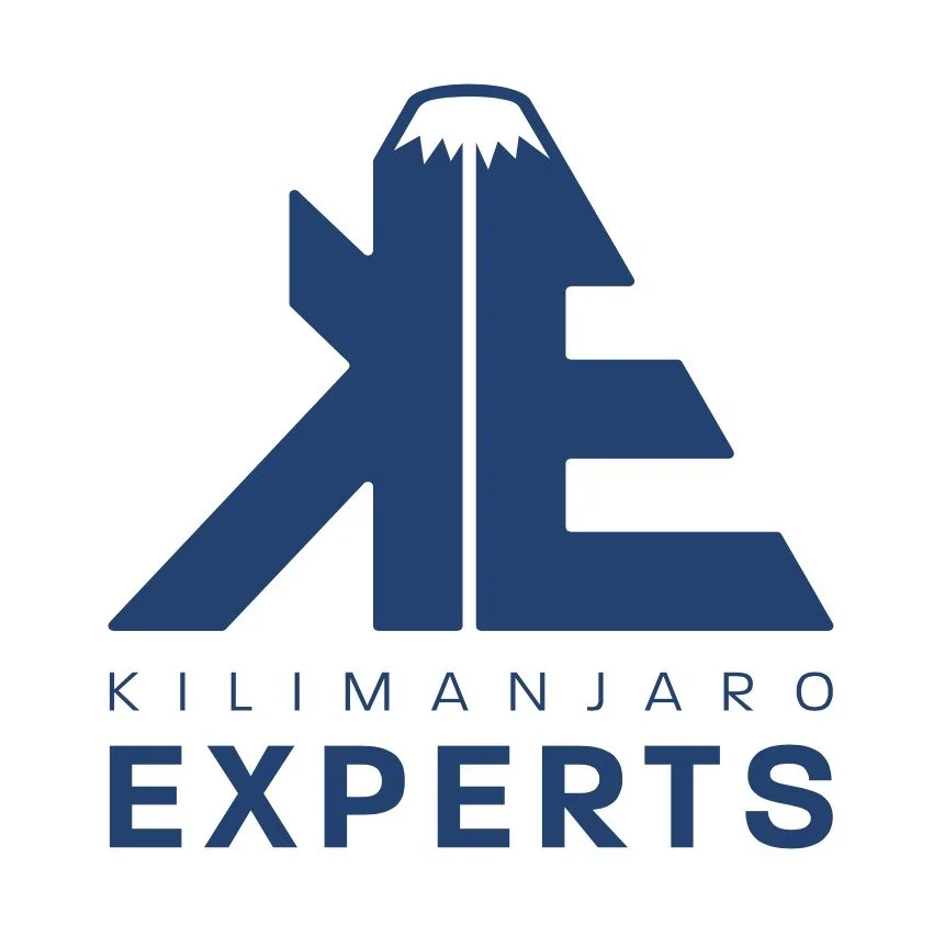Logo of Kilimanjaro Experts featuring stylized mountain and tree graphics with the company name.
